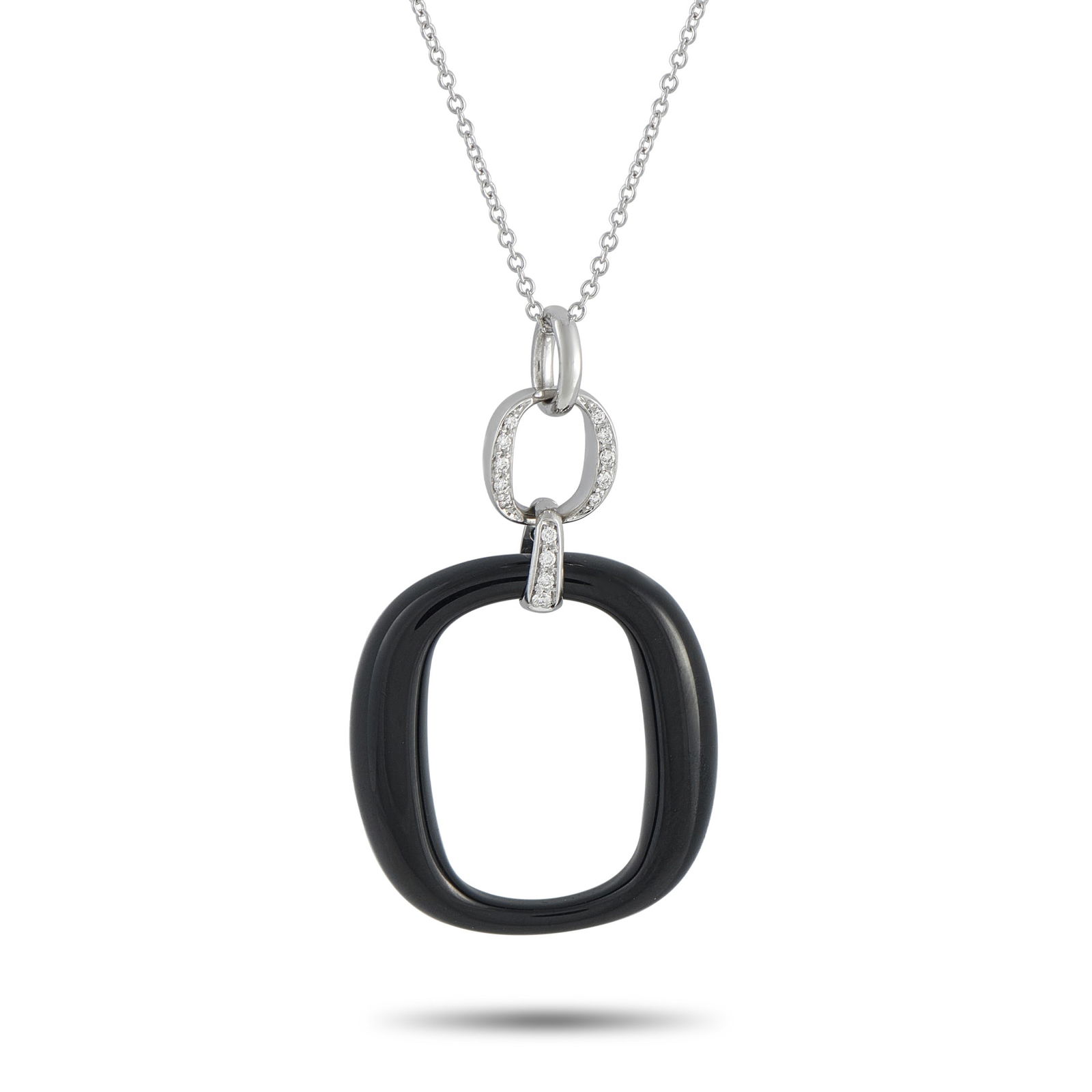 Damiani18K White Gold Diamond and Onyx Necklace: A minimalist design gives this Damiani necklace a contemporary point of view. Suspended from a 19.5” chain, the dramatic pendant pairs black Onyx with sparkling inset Diamonds. The pendant is cr