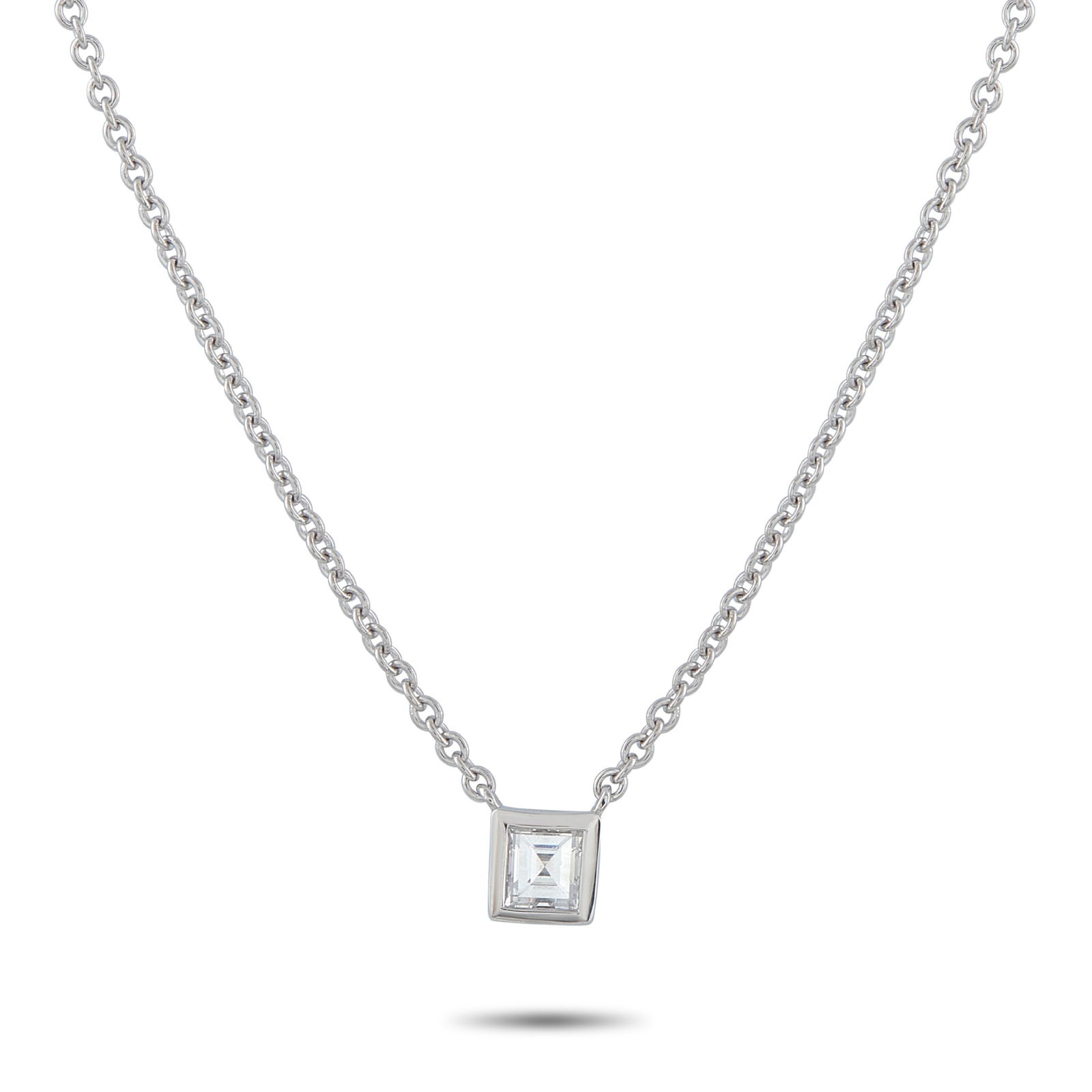 Exclusive 18K White Gold 0.40ct Diamond Solitaire Necklace: A single diamond, just 0.19? across, rests in a clean square bezel, suspended from a polished white gold chain. Its petite size emphasizes restraint, letting clarity and like take center stage. The mi