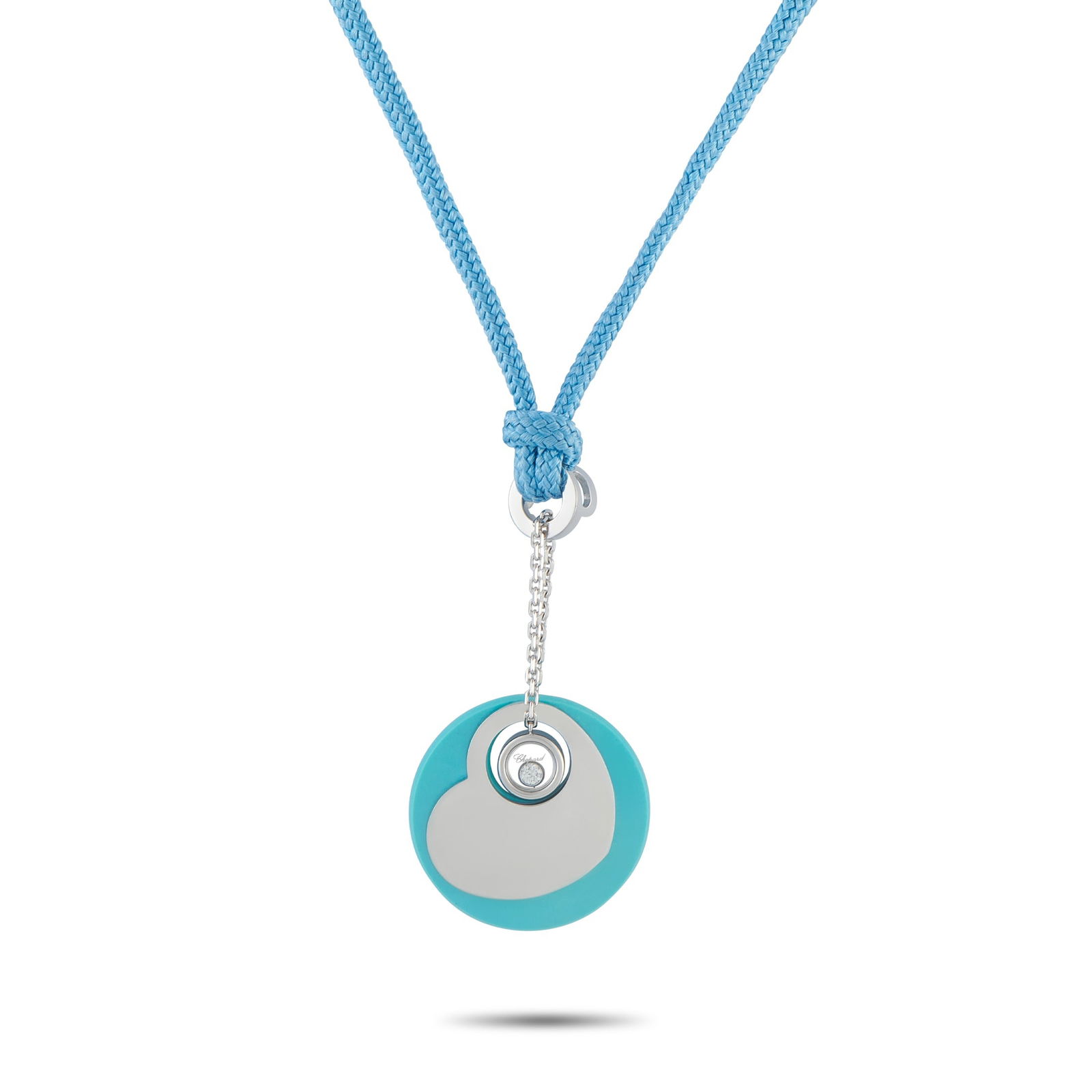 Chopard18K White Gold Diamond and Turquoise Necklace: On this Chopard necklace, the luxury brand’s playful energy is impossible to ignore. A single Diamond floats at the center of this piece’s charming heart-shaped pendant. The 17” blue cord al