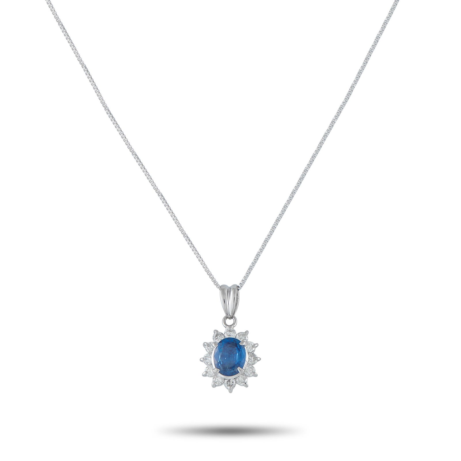 Exclusive Platinum 0.44ct Diamond and Sapphire Pendant: Add a touch of classic elegance to any ensemble with this timeless necklace. Set in Platinum, it features a 1.15 carat Sapphire center stone surrounded by Diamonds with a total weight of 0.44 carats.