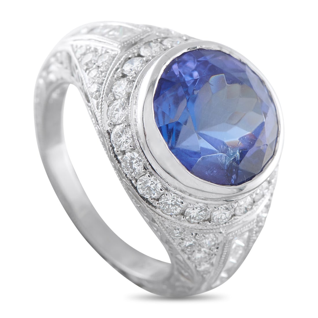 18K White Gold 1.20ct Diamond and Tanzanite Ring: 18K White Gold 1.20ct Diamond and Tanzanite Ring This luxury ring will never go out of style. Diamonds with a total weight of 1.20 carats add sparkle to the exquisite 18K White Gold setting – but it