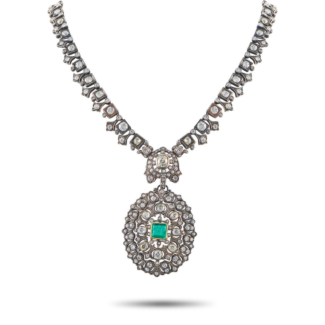 14K Yellow Gold and Silver 27.0ct Diamond and Emerald Necklace: 14K Yellow Gold and Silver 27.0ct Diamond and Emerald Necklace An intricate openwork design makes this necklace instantly captivating. Crafted from a combination of 14K Yellow Gold and Silver, this lu