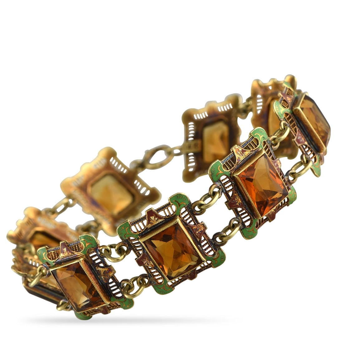 Antique 14K Yellow Gold Citrine and Enamel Bracelet: Antique 14K Yellow Gold Citrine and Enamel Bracelet DESCRIPTION ESTATE This luxury bracelet exudes a distinct sense of old fashioned elegance. Green enamel accents contrast beautifully against intrica