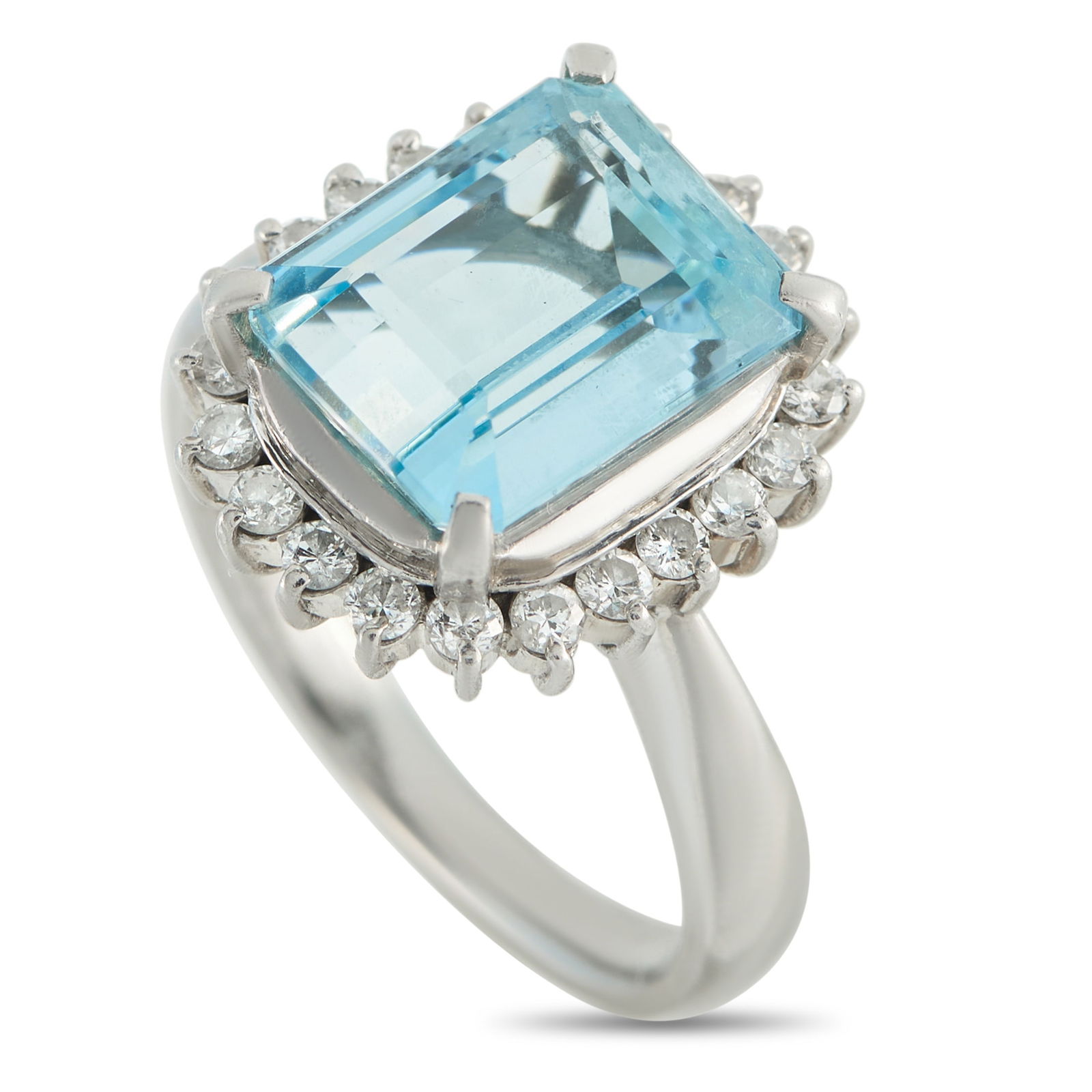 Platinum 0.48ct Diamond and Aquamarine Ring: In this ring, a 4.32-carat step-cut aquamarine sits proudly within four refined prongs. Its crisp facets and gentle blue glow are enhanced by the soft brilliance of a starburst halo of diamonds. The