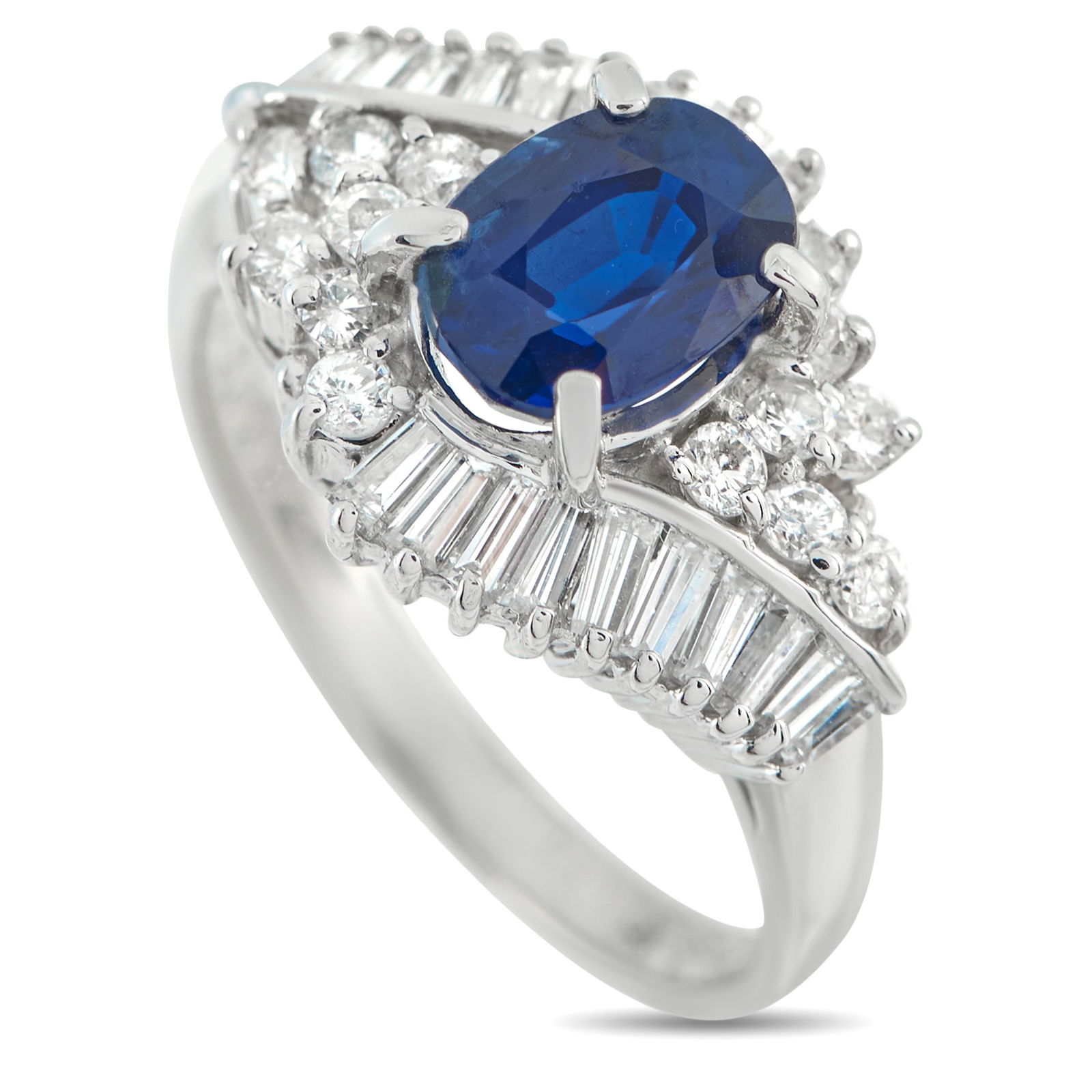 Platinum 0.84ct Diamond and Sapphire Ring: This piece highlights a 1.80-carat sapphire set at the center, glowing in deep blue. Surrounding it are 0.84 carats of diamonds in round and baguette cuts, forming a marquise-shaped frame. The mix of