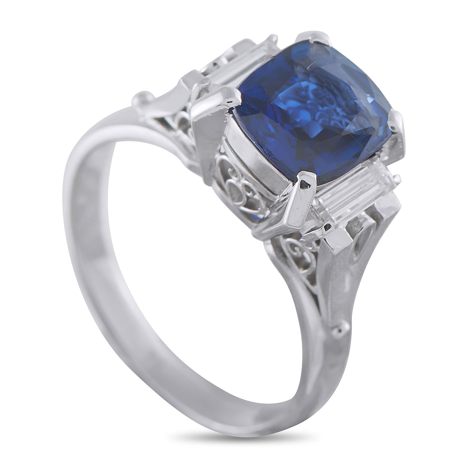 Platinum 0.38ct Diamond and Sapphire Ring: A 1.97 ct blue sapphire rises markedly above this platinum band, giving the blue stone clear separation and presence. It is lifted into view and secured by tall, slender prongs at each corner. V-shape