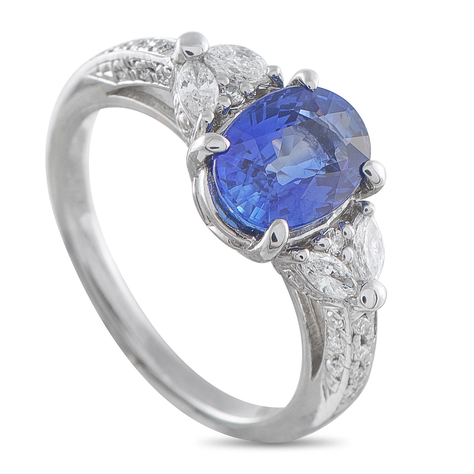 Platinum 0.31ct Diamond and Sapphire Ring: Traditional at its core, but never understated. This ring is marked by an oval blue sapphire center stone set on four prongs. A pair of marquise diamonds flank the vivid gem, extending the line outwar