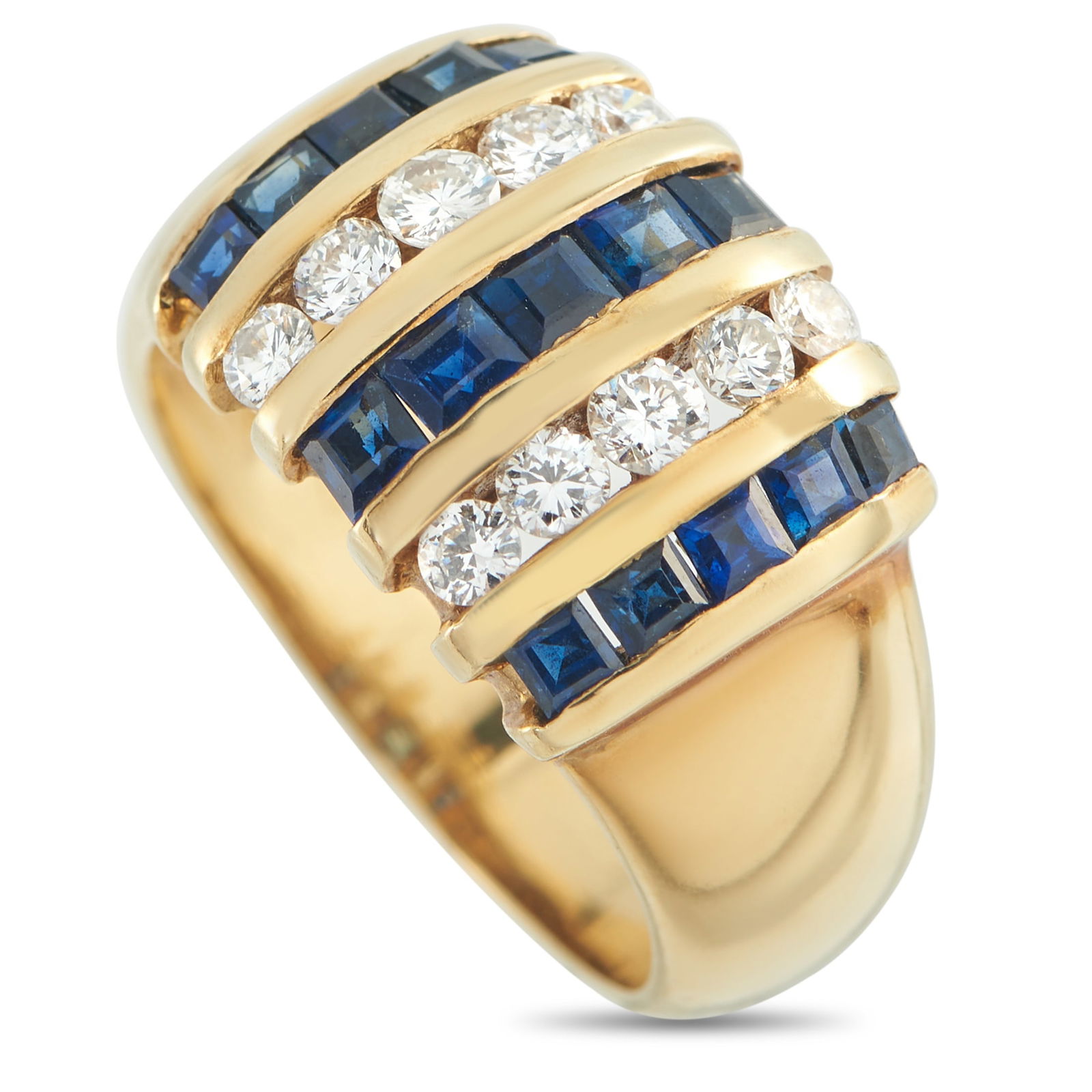 18K Yellow Gold 0.60ct Diamond and Sapphire Ring: A bold, statement-making 18K Yellow Gold setting provides the perfect foundation for this impressive luxury ring. Round-cut Diamonds totaling 0.60 carats add plenty of sparkle to the overall design, w