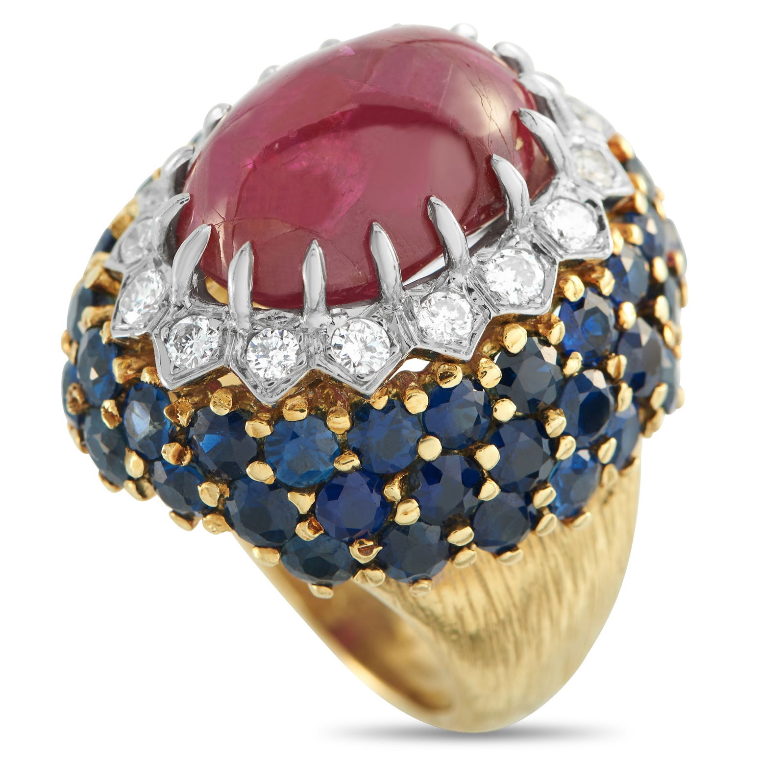 18K Yellow Gold 0.64ct Diamond, Ruby, and Sapphire Ring: Bold colors make this luxury ring an exquisite addition to any ensemble. At the center, a 16.0 carat Ruby cabochon serves as a stunning focal point. Diamonds totaling 0.64 carats surround the center s