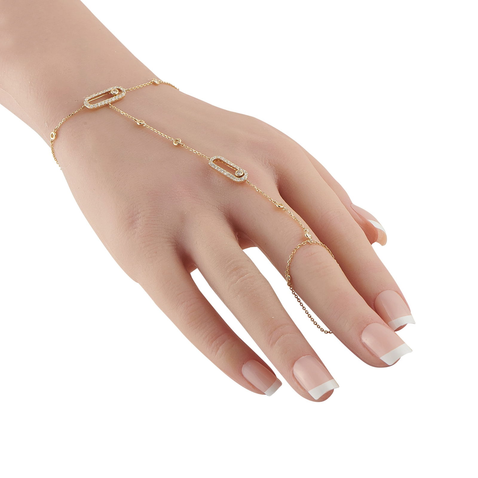 14K Yellow Gold 0.80ct Diamond Hand Chain: This hand chain bracelet is filled with dynamic details. Subtle yet statement making, the 14K Yellow Gold chain wraps around the wrist and extends over the middle finger. Diamonds with a total weight