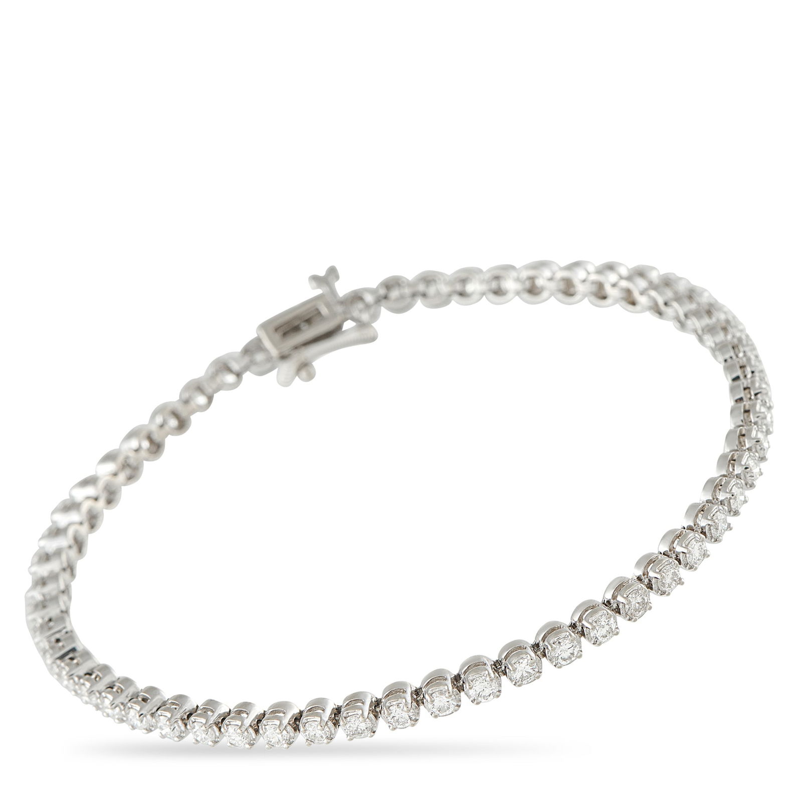 14K White Gold 1.65ct Diamond Tennis Bracelet: The perfect everyday wrist companion. This tennis bracelet is rendered in 14K white gold and carries 1.65 carats of diamonds. The precious stones catch the light like morning dew, bright enough to be