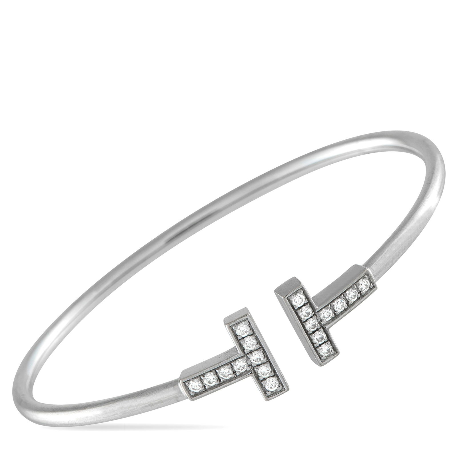 Tiffany & Co. 18K White Gold Diamond T Bracelet: Modern and sophisticated, this Tiffany & Co. T Wire Bracelet pays homage to the luxury brand’s enduring legacy. At each end of the sleek 18K White Gold bangle, a signature “T” comes to life