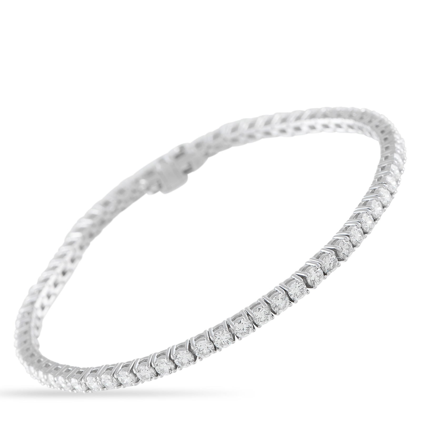 14K White Gold 4.70ct Diamond Tennis Bracelet: Diamonds with a total weight of 4.70 carats make this tennis bracelet endlessly impressive. A luxury piece that is ideal for everyday wear, it features a simple 14K White Gold setting and measures 7.2