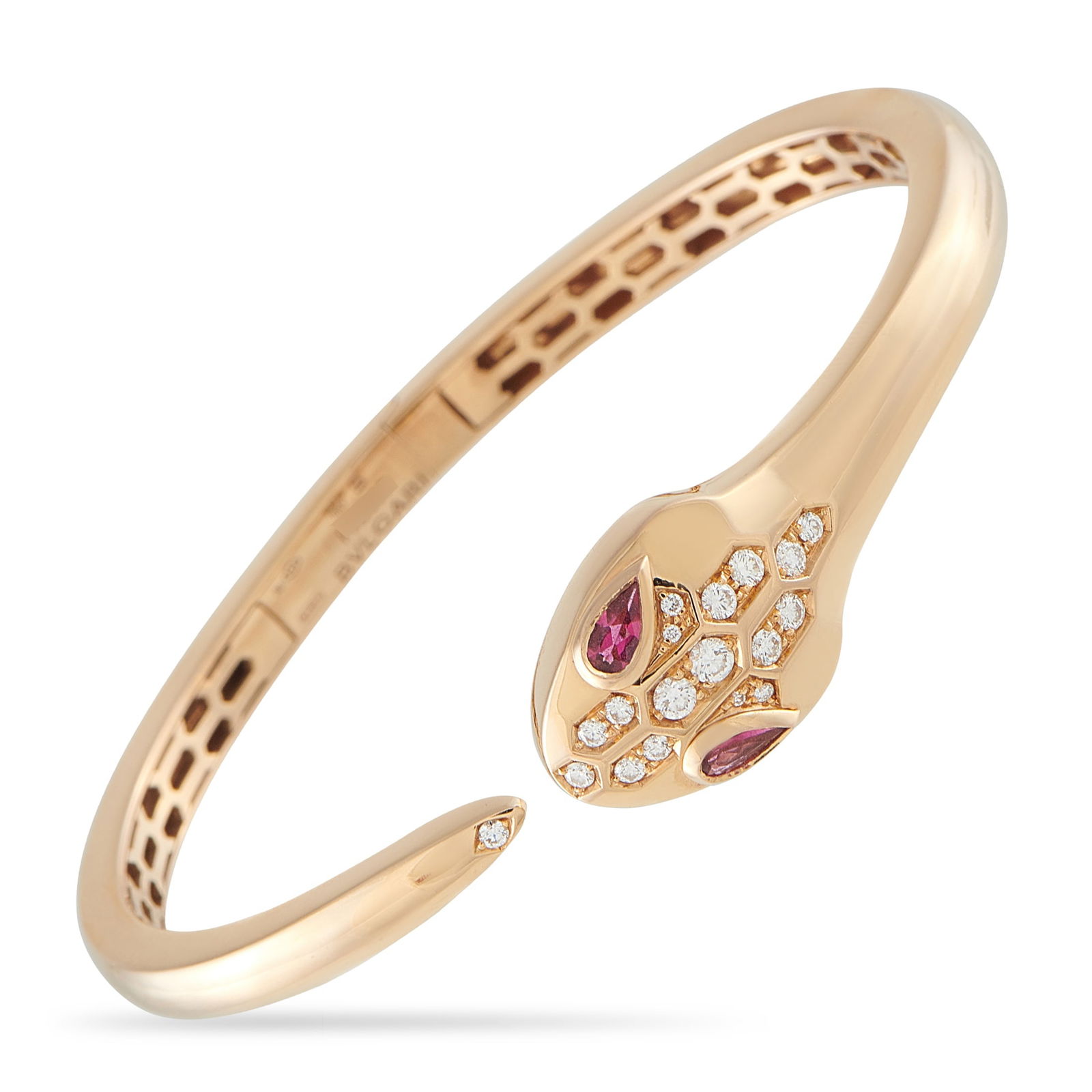 Bvlgari Serpenti Seduttori 18K Rose Gold Diamond and Ruby Bracelet: A rose gold Serpenti bracelet embodying the Seduttori ethos. This piece features a slim, hinged bangle bracelet design that encircles the wrist with effortless elegance. The serpent’s head is detail