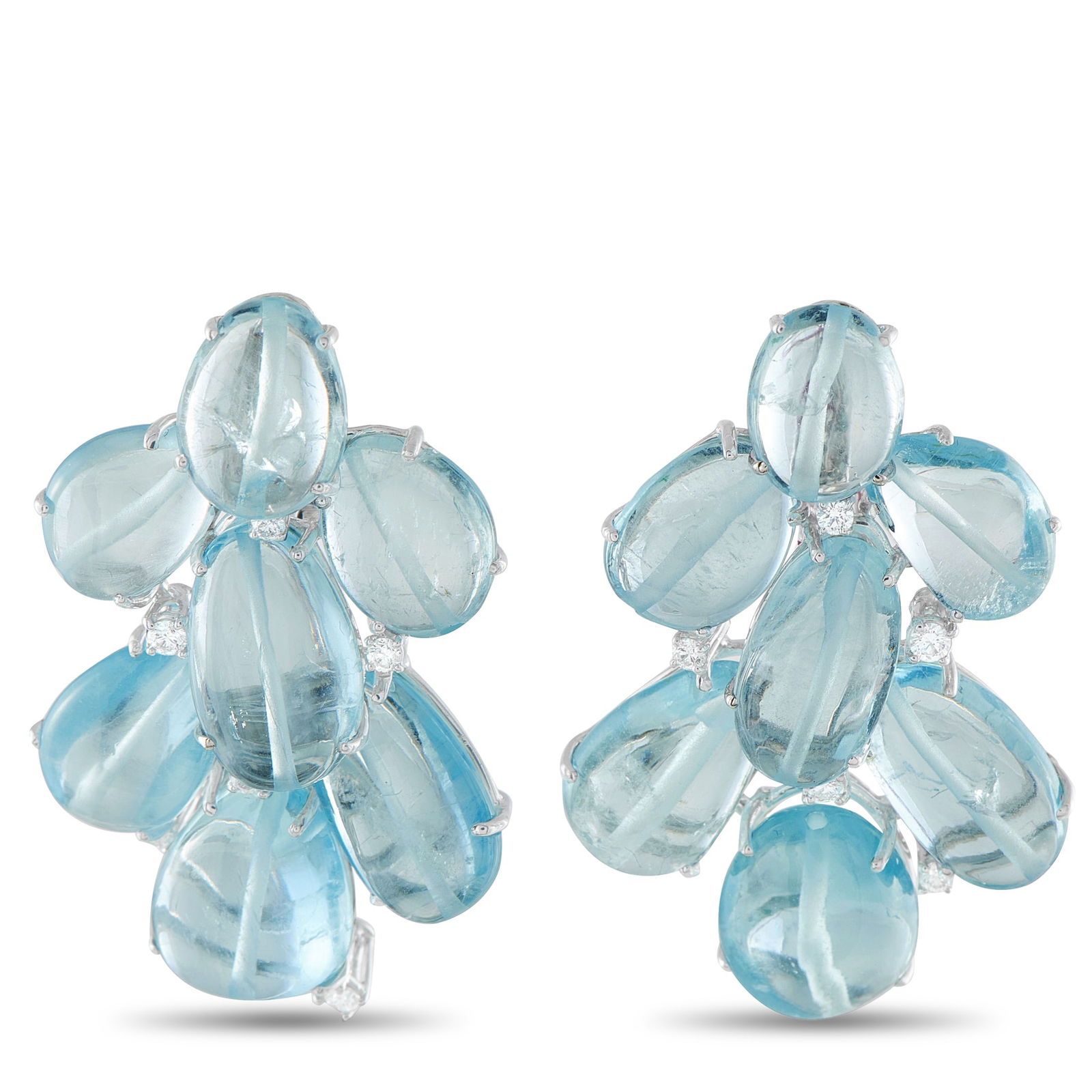 18K White Gold 0.72ct Diamond and Aquamarine Earrings: This pair of statement earrings celebrates natural beauty through an extraordinary 130.0 total carats of aquamarine. Each stone is selected for its translucent, sea-foam clarity and arranged in a casc