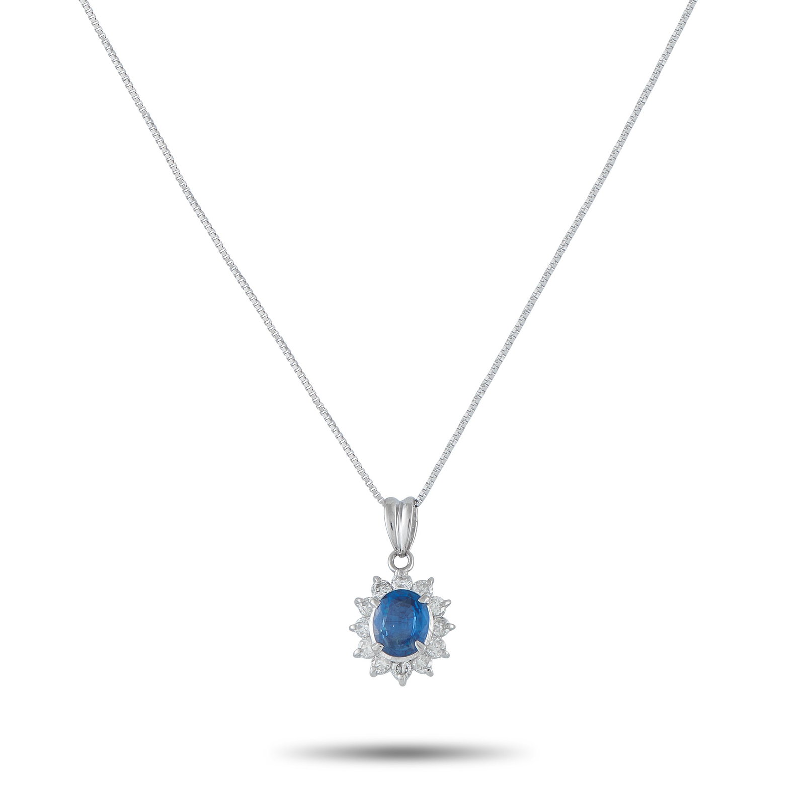 Platinum 0.44ct Diamond and Sapphire Pendant: Add a touch of classic elegance to any ensemble with this timeless necklace. Set in Platinum, it features a 1.15 carat Sapphire center stone surrounded by Diamonds with a total weight of 0.44 carats.