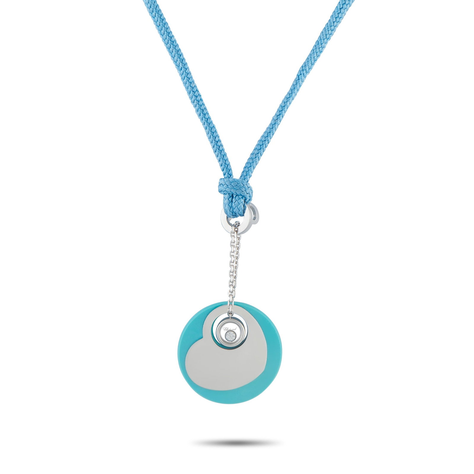 Chopard18K White Gold Diamond and Turquoise Necklace: On this Chopard necklace, the luxury brand’s playful energy is impossible to ignore. A single Diamond floats at the center of this piece’s charming heart-shaped pendant. The 17” blue cord al
