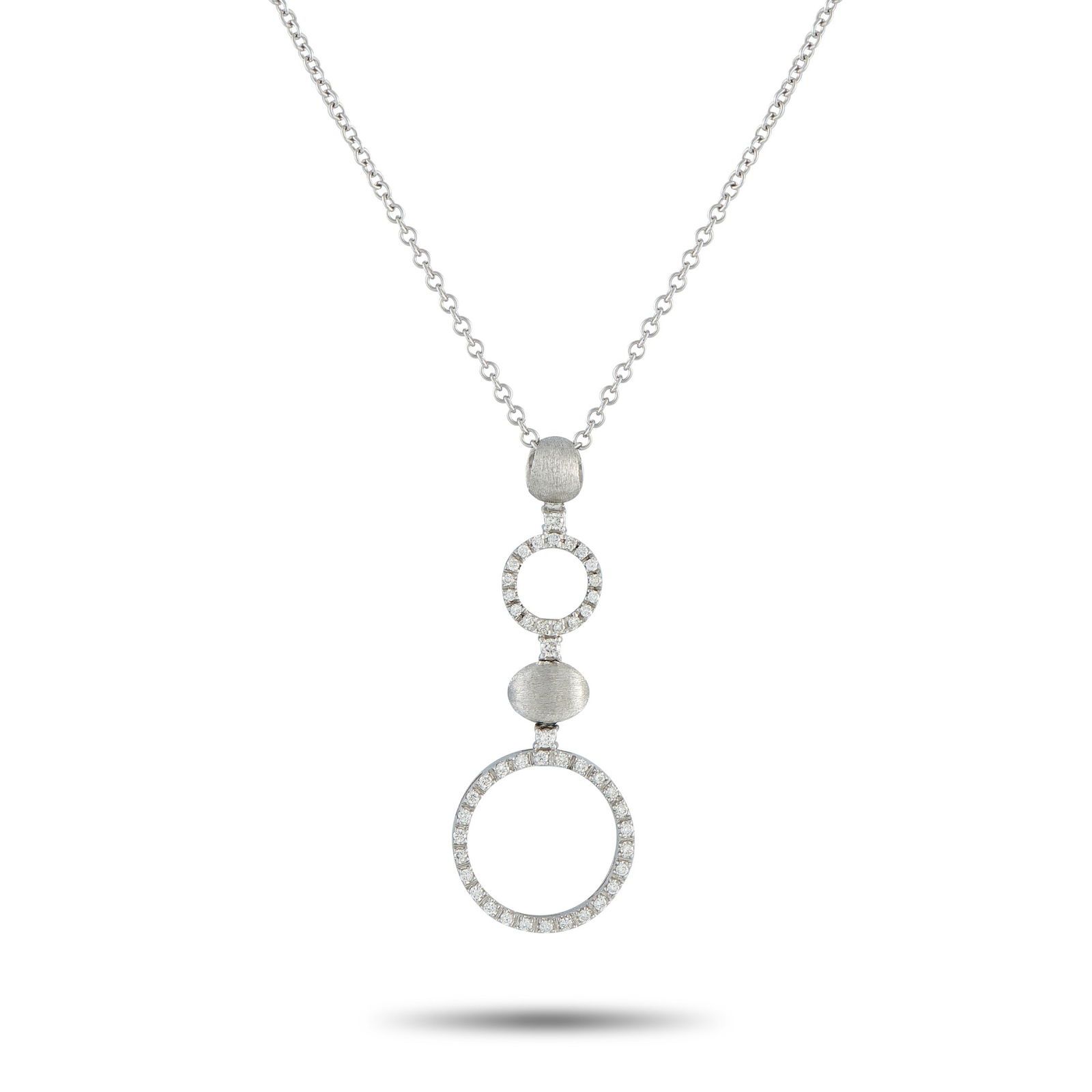 Nanis 18K White Gold 0.65ct Diamond Necklace: A sleek, contemporary design makes this Nanis necklace an elegant addition to any jewelry collection. Set in 18K White Gold, the circular forms are elevated by sparkling Diamonds with a total weight o