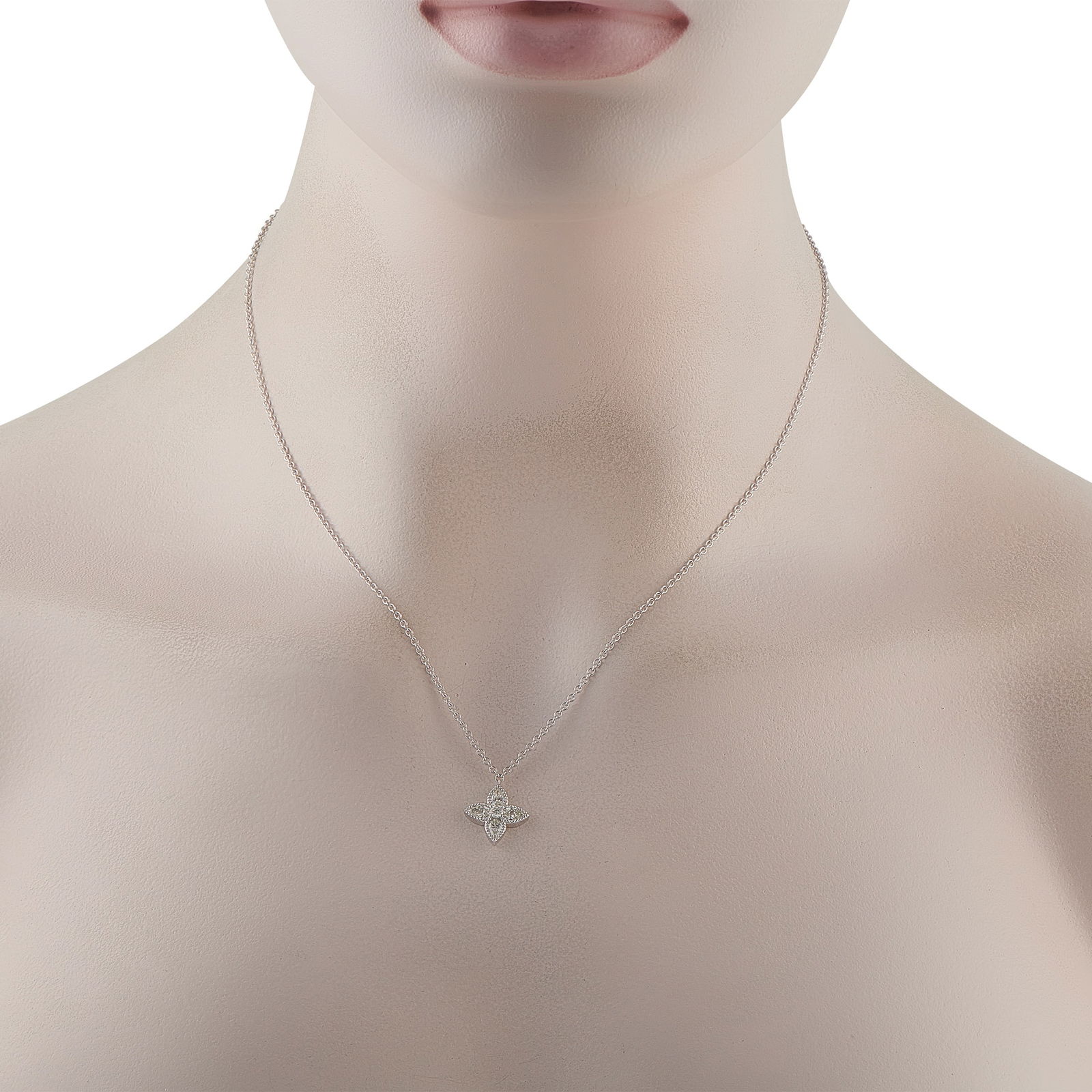 18K White Gold 0.73ct Diamond Quatrefoil Necklace: Softly feminine with a timeless character, this classic necklace centers on a pointed quatrefoil pendant crafted in white gold. Each of the four tops is edged with fine beading and set with a pear-cut