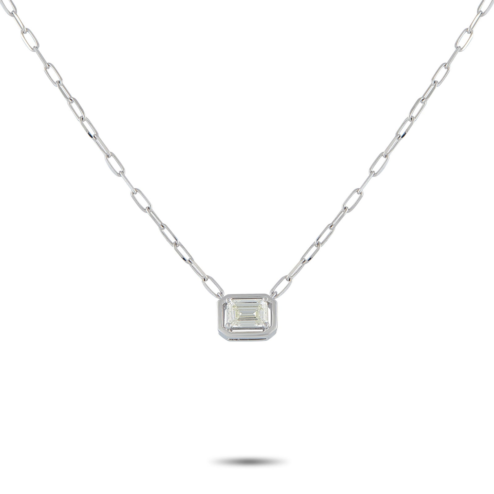18K White Gold 0.75ct Emerald-Cut Diamond Solitaire Necklace: Clean and contemporary, this solitaire blends structure with understated charm. The white gold chain, with paperclip-like links, holds an eight-sided frame that supports an emerald-cut diamond on four