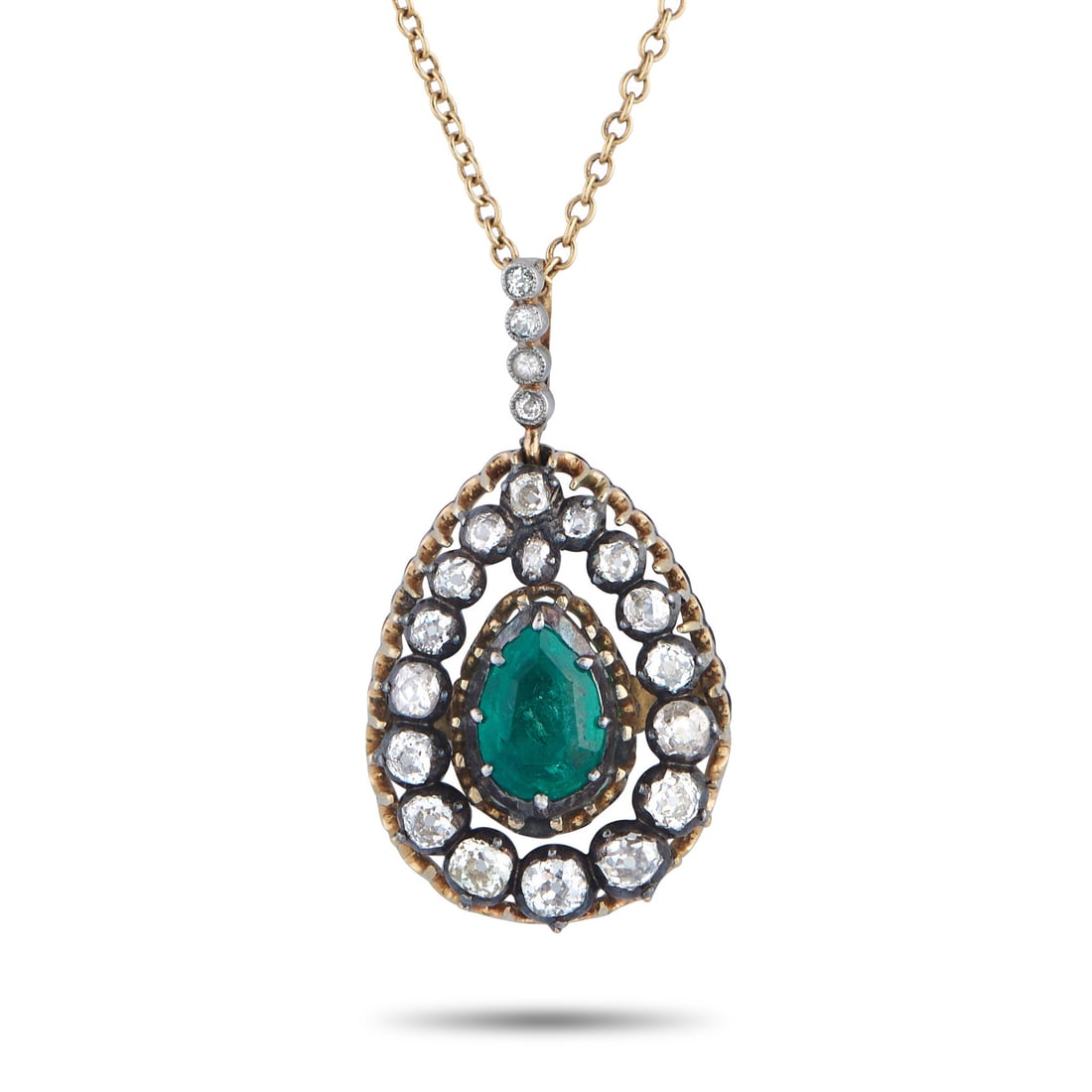 14K Yellow Gold Silver 1.0ct Diamond and Emerald Necklace: Drawn from earlier jewelry traditions, the pendant reflects a time when diamonds were cut by hand rather than formula. Old mine-cut diamonds create a pear-shaped frame, tapering gently toward the pear