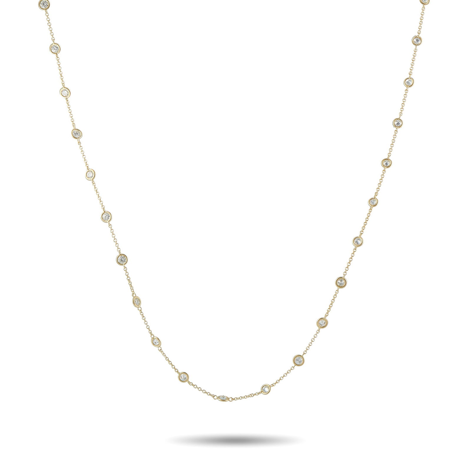 14K Yellow Gold 4.42ct Diamond Station Necklace: A dramatic length and an understated sense of style provide this Diamonds By The Yard style necklace with beautiful balance. Stylish and sophisticated, the 14K Yellow Gold chain is elevated by a serie