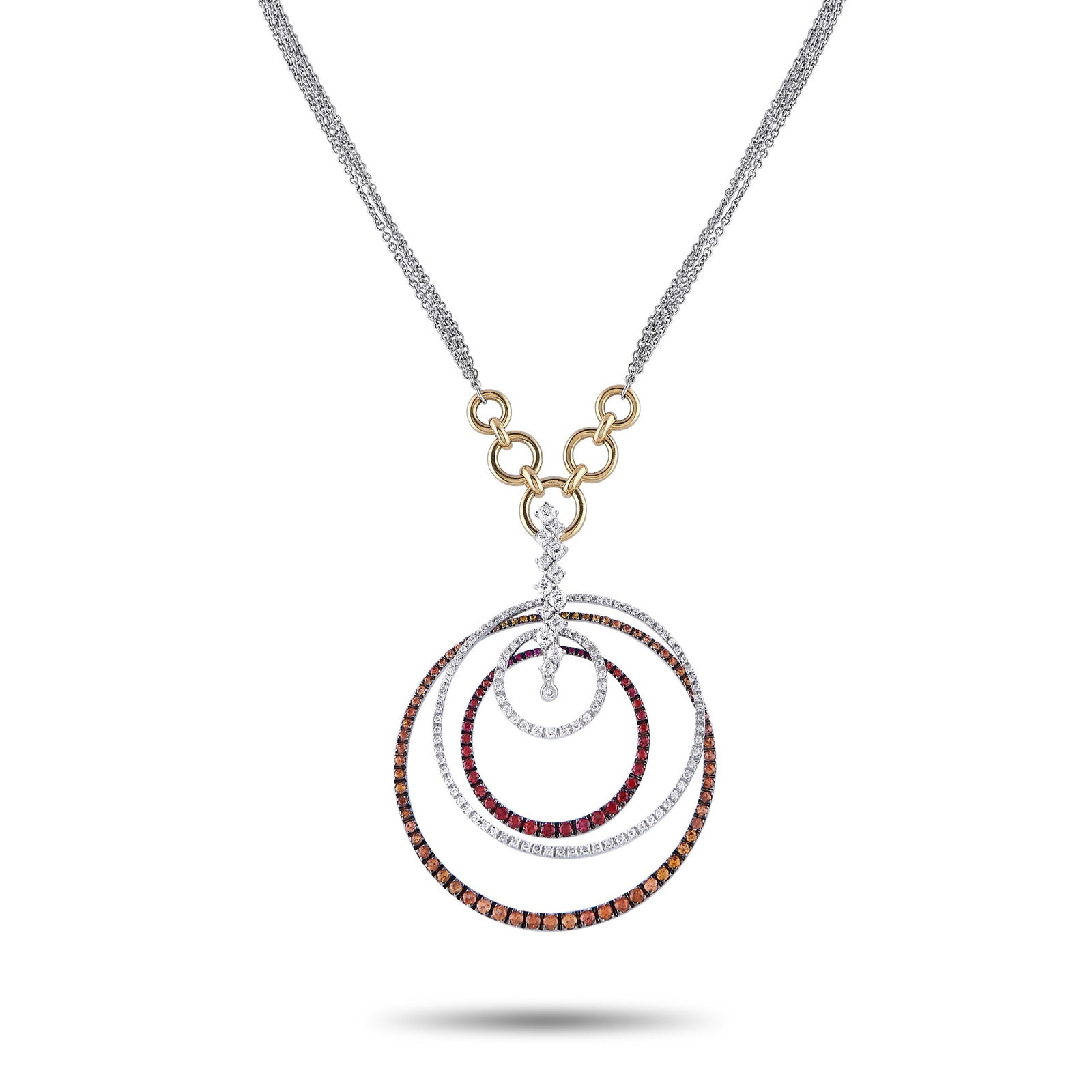 Staurino Fratelli18K White and Yellow Gold 1.80ct Diamond and Sapphire Necklace: This Staurino Fratelli necklace combines traditional forms with contemporary elegance. The breathtaking pendant features concentric circles, colorful Sapphires totaling 3.30 carats, and a central arra