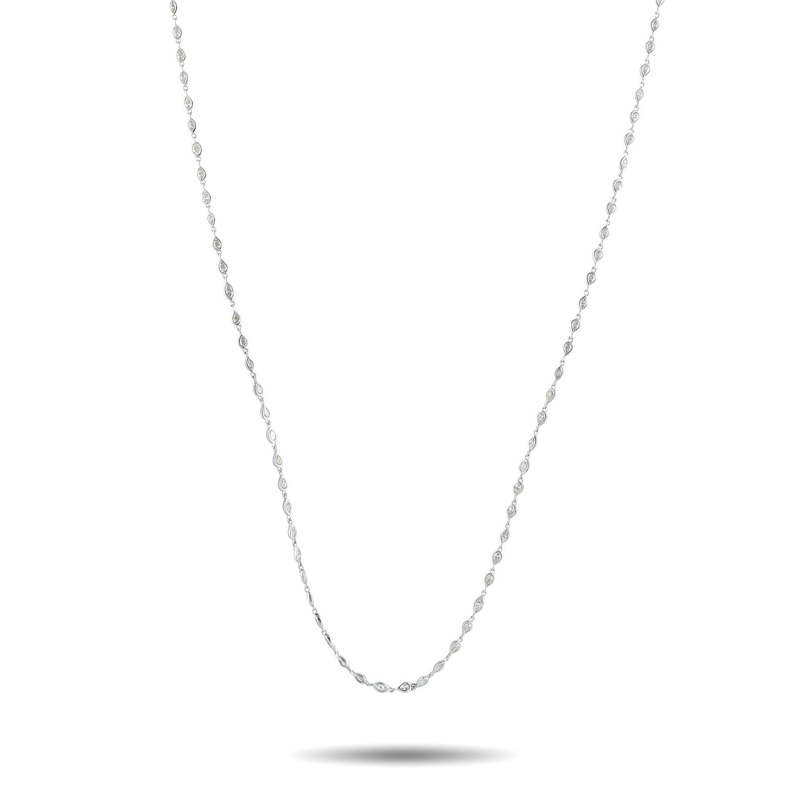 18K White Gold 7.85ct Diamond Long Necklace: A versatile necklace that layers beautifully yet stands out on its own. This piece features a continuous line of delicate pear-shaped and marquise-shaped bezels, each set with a fine diamond. The peti