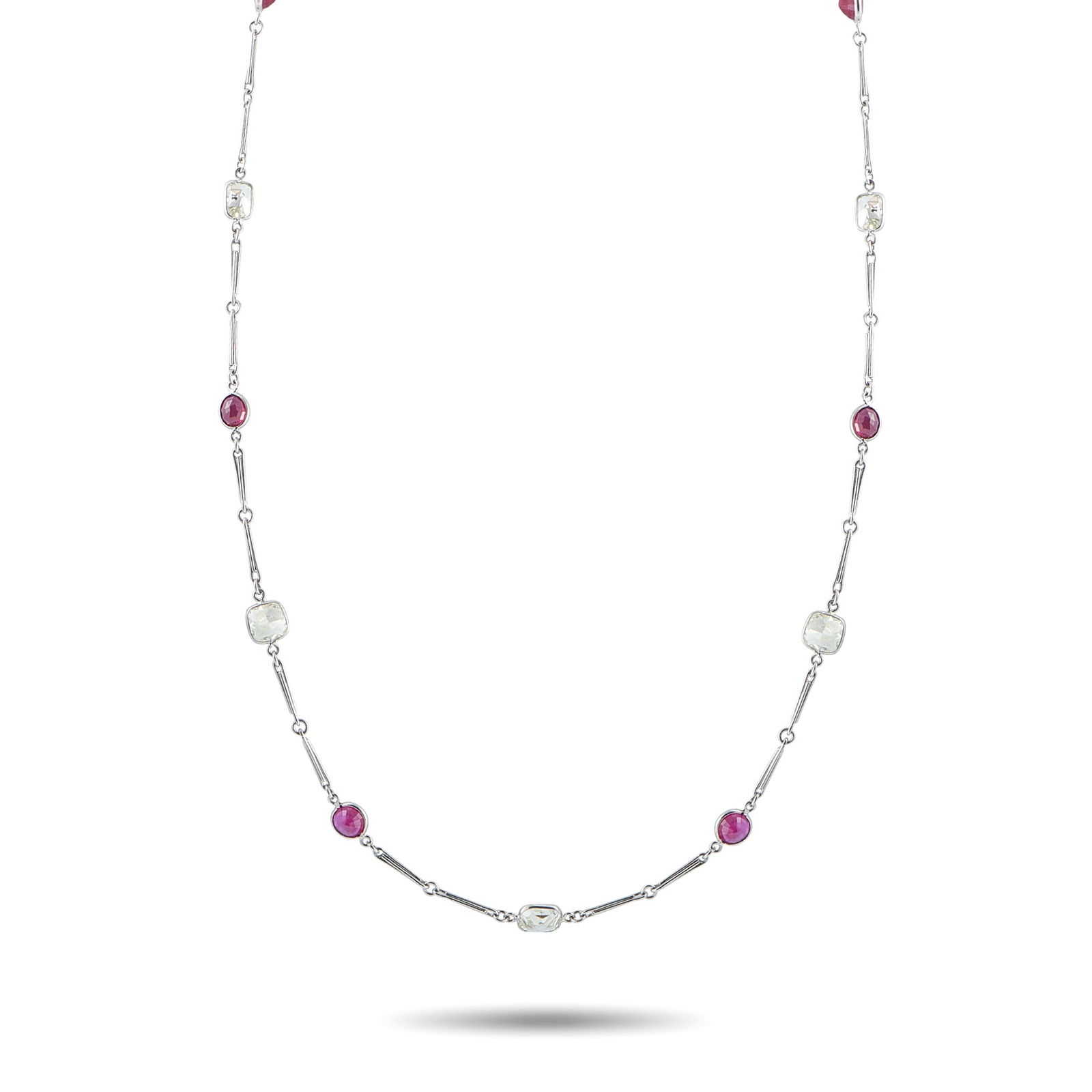 Platinum 7.25ct Diamond and Ruby Necklace: An understated design makes this luxury necklace a wearable piece that is perfect for any occasion. Simple and elegant, the Platinum chain is elevated by Ruby gemstones totaling 7.50 carats and Diamon