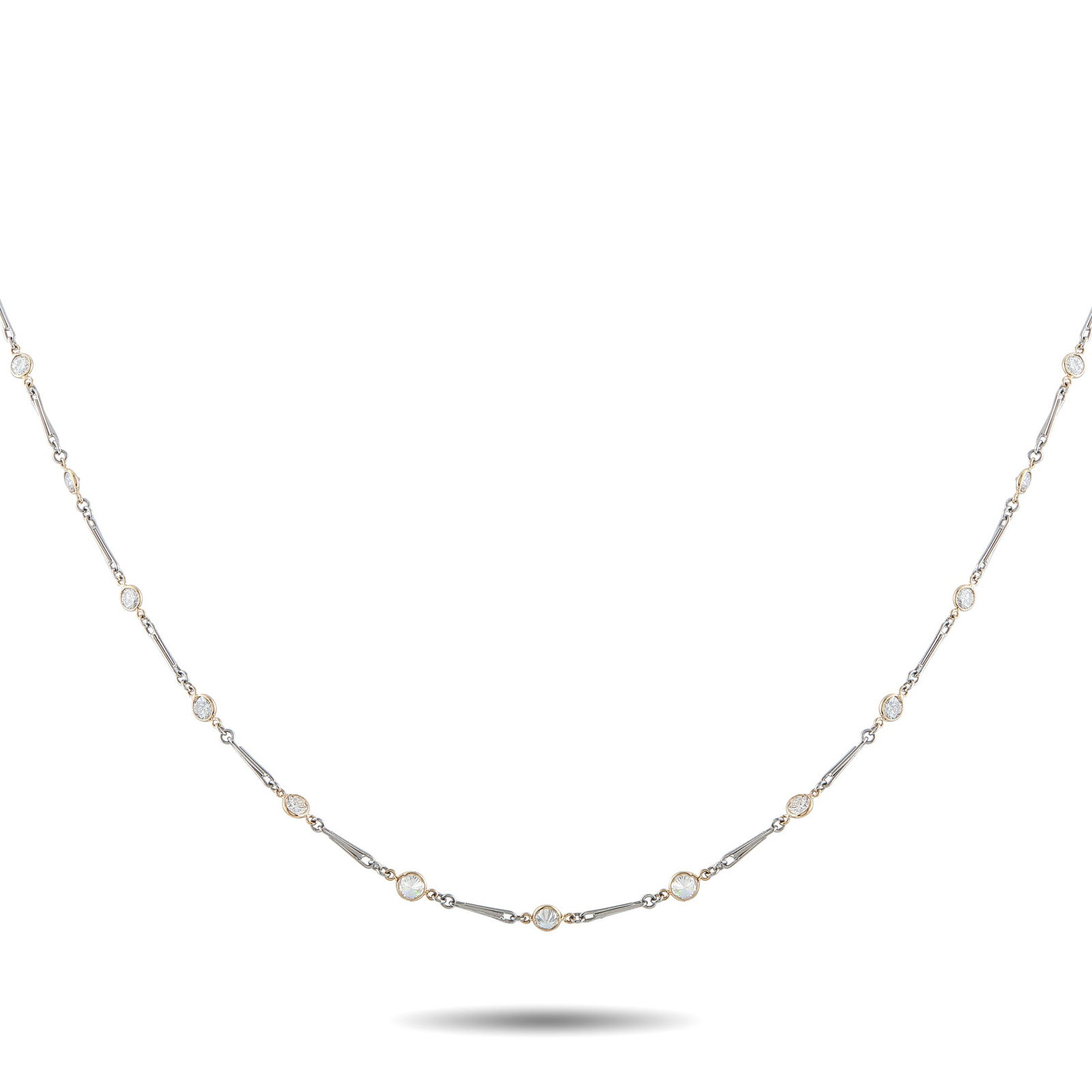Platinum and 18K Yellow Gold 10.50 ct Diamond Long Necklace: A two-toned necklace designed for looping, layering, and personal styling. Platinum links echo paperclip geometry, slim, linear, and modern. Between them are round diamonds that appear within yellow g