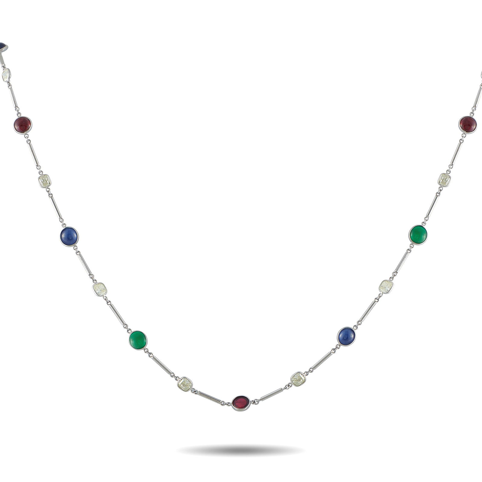 Platinum 10.47 ct Diamond, 10.22 ct Emerald, 15.13 ct Sapphire and 13.11 ct Spinel Long Necklace: Rich hues define this necklace, with emerald, sapphire, and spinel placed one at a time along a line. Across 32 inches, platinum rod links alternate with bezel-set gems, with 10.47 carats of diamonds