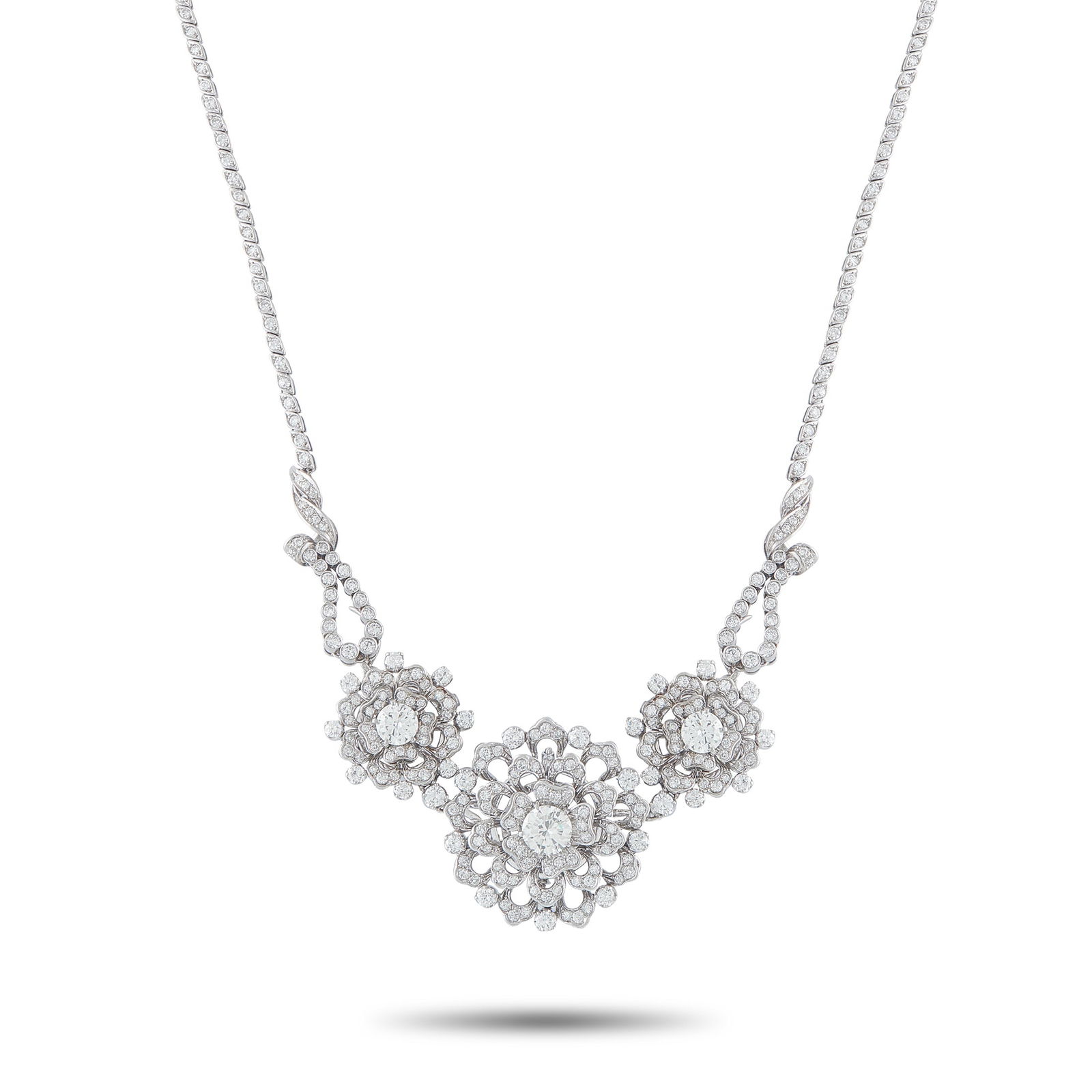 Platinum 10.70ct Diamond Necklace: This luxury necklace is undeniably elegant. Floral motifs and an intricate, openwork design beautifully showcase this piece’s sparkling Diamonds. A 1.75 carat Diamond makes a statement at the center