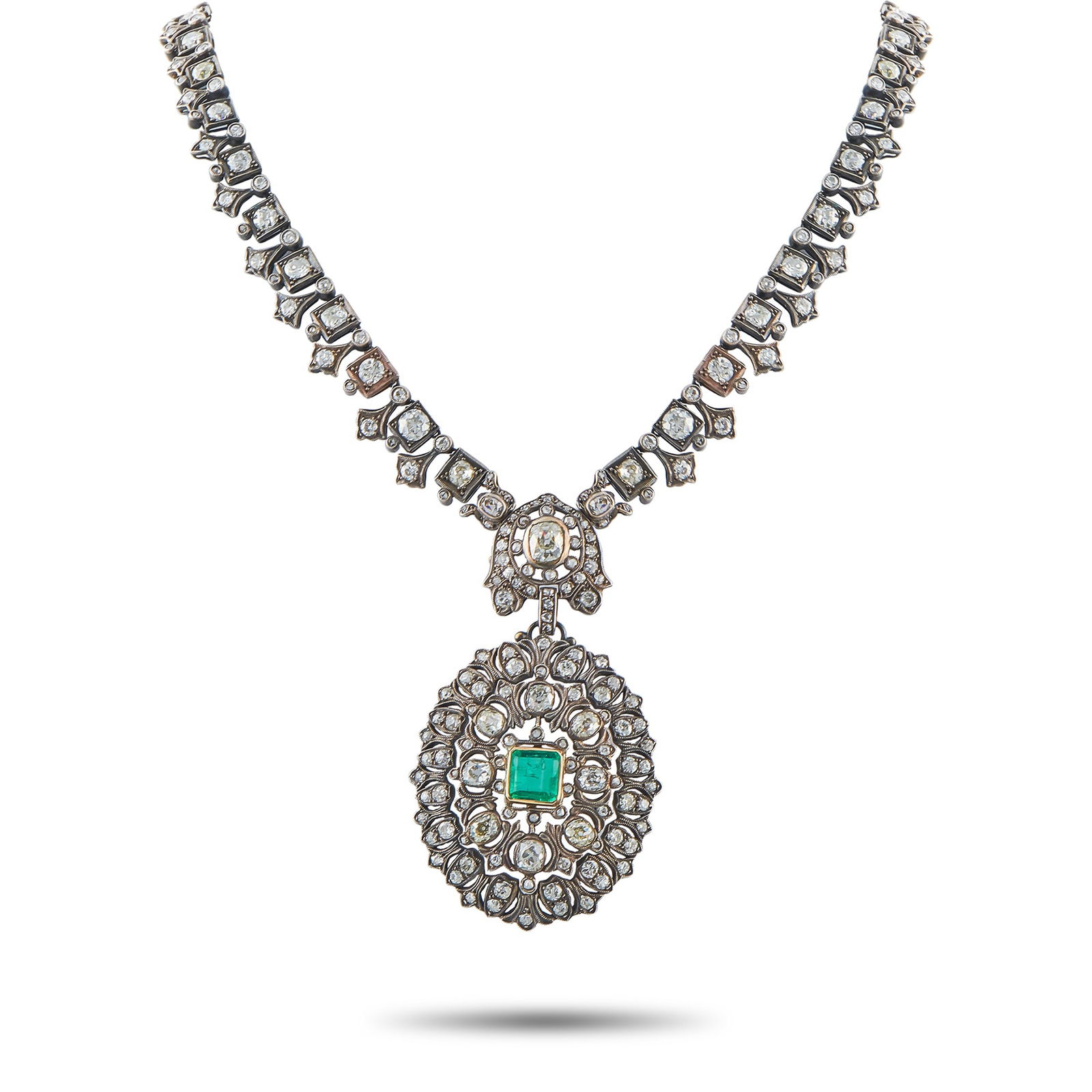 14K Yellow Gold and Silver 27.0ct Diamond and Emerald Necklace: An intricate openwork design makes this necklace instantly captivating. Crafted from a combination of 14K Yellow Gold and Silver, this luxury piece comes to life thanks to sparkling Diamonds with a to