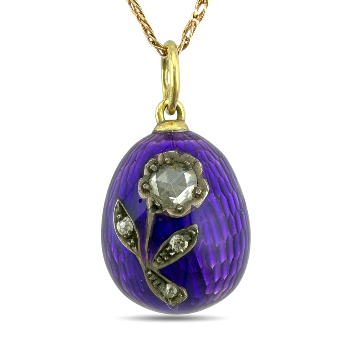Imperial Russian Fabergé 14K Yellow Gold Purple Enamel and 0.50ct Diamond Egg Pendant: Imperial Russian Fabergé 14K Yellow Gold Purple Enamel and 0.50ct Diamond Egg Pendant This authentic Imperial Russian Fabergé pendant is crafted in 14K yellow gold and decorated with deep purple ena