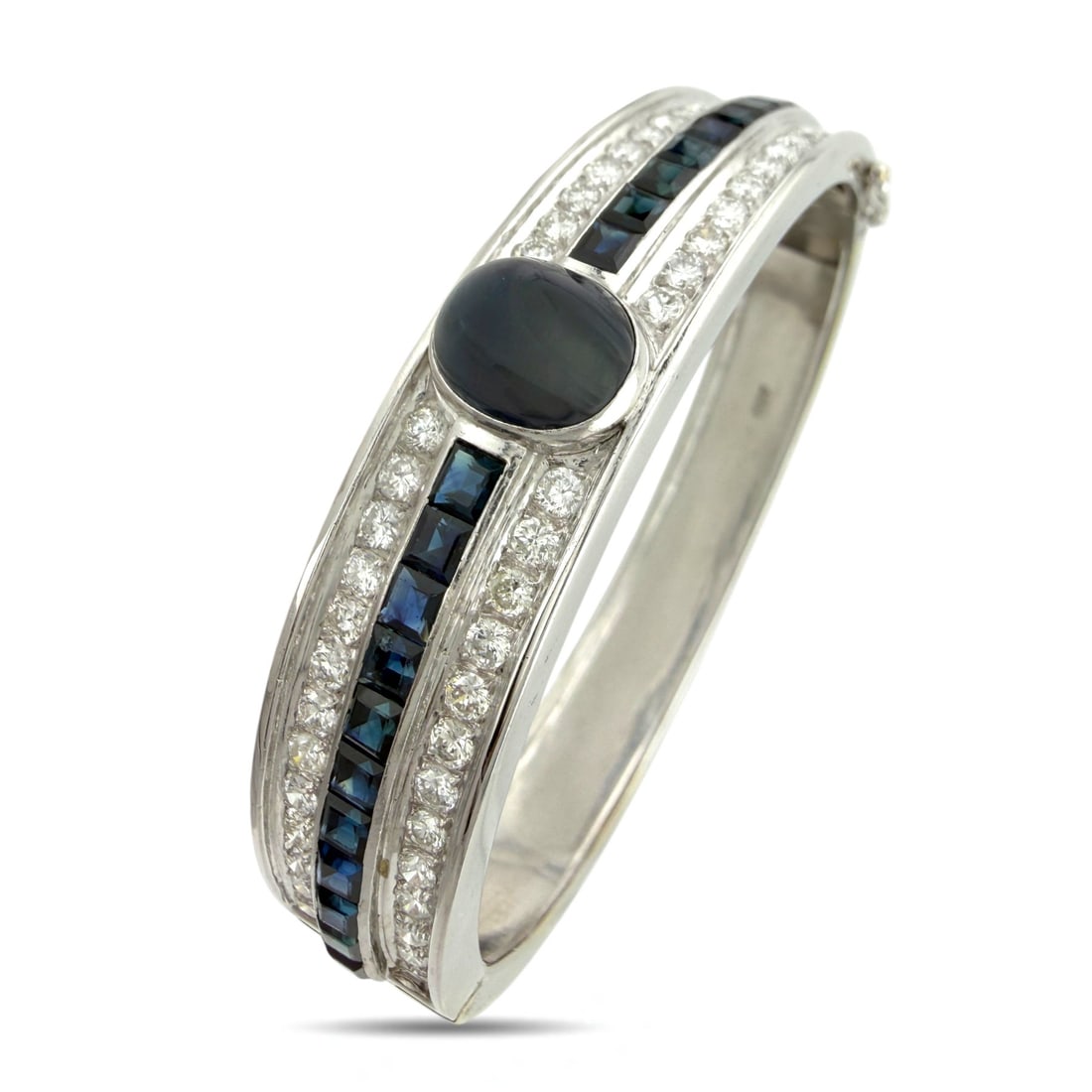 Exclusive 18K White Gold 4.50ct Diamond and 9.65ct Sapphire Bracelet: Exclusive 18K White Gold 4.50ct Diamond and 9.65ct Sapphire Bracelet This elegant bracelet presents a vivid rhythm of diamonds and sapphires arranged in a refined, architectural flow. Square cut sapph