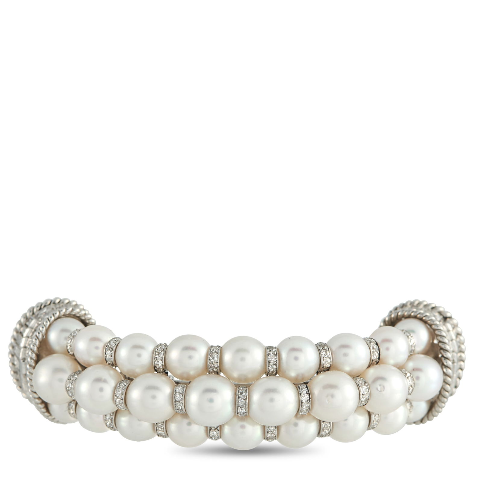 Platinum 3.80ct Diamond and Pearl Brooch: A curved Platinum setting adds dimension to this uniquely elegant brooch. Rows of Pearls provide this piece with a luminous quality, while Diamonds with a total weight of 3.80 carats add an additional