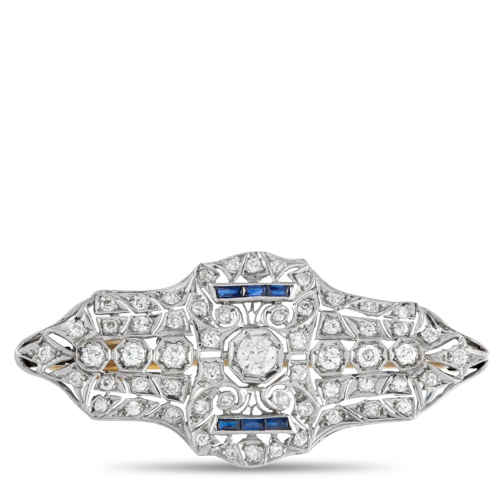 18K White Gold 3.0ct Diamond and Sapphire Art Deco Brooch: A clean expression of Art Deco design. This white gold brooch features over 3.0 carats of diamonds set in crisp, geometric rows with delicate milgrain edges. Two slim channels of step-cut sapphires ad