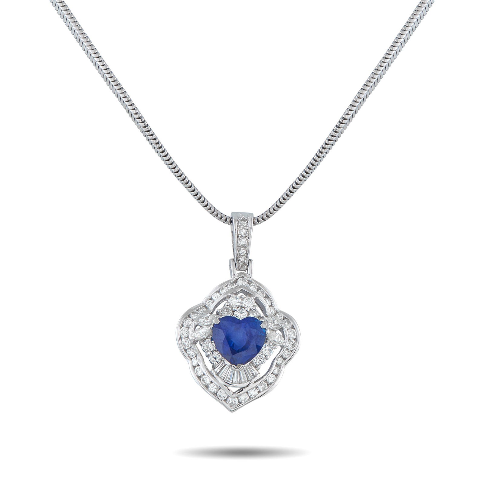 Exclusive Platinum 1.35ct Diamond and Sapphire Pendant: This luxury necklace is the perfect accessory for anyone who has captured your heart. A heart-shaped 2.66 carat Sapphire makes a statement at the center, while additional Diamond accents totaling 1.35