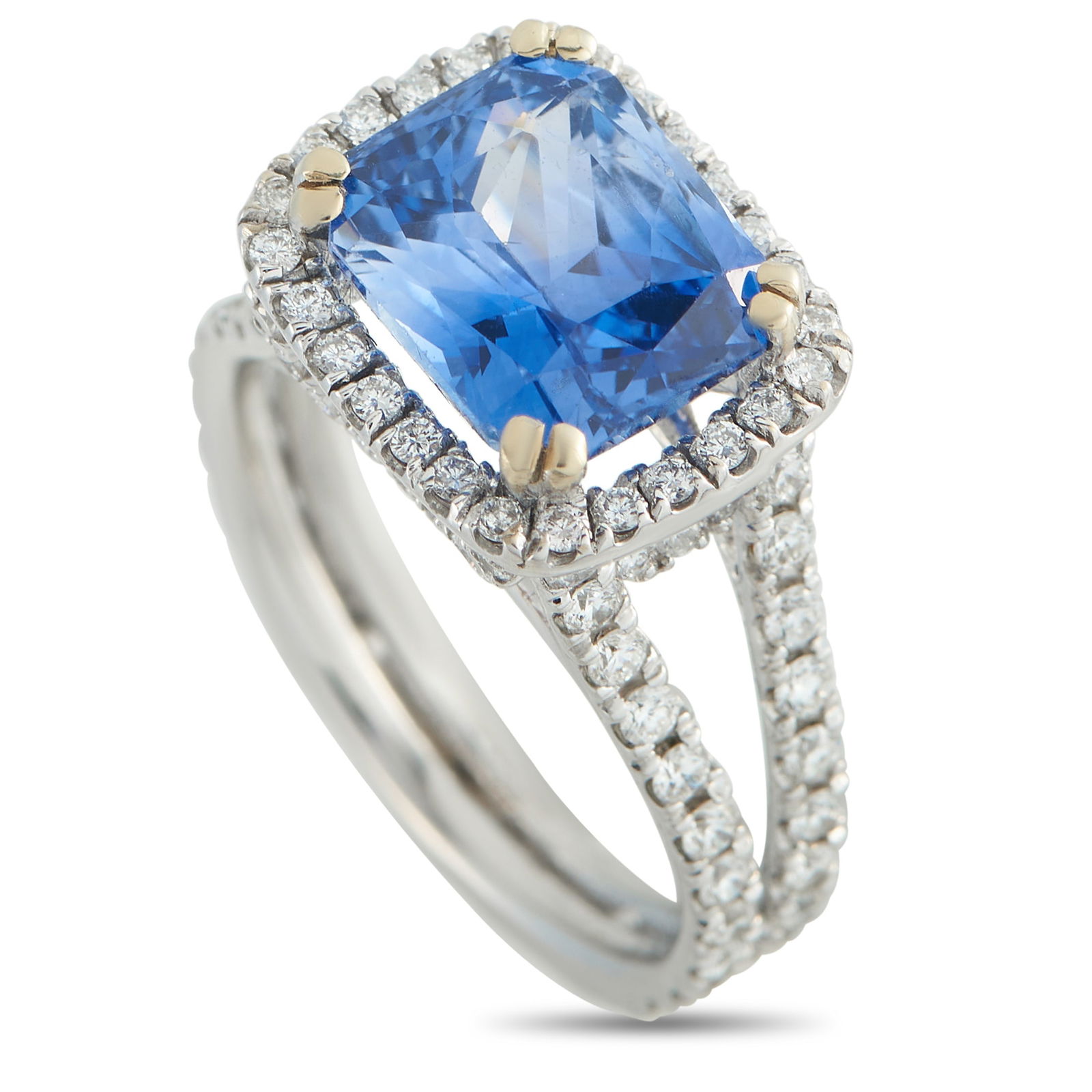 Exclusive 18K White Gold 1.10ct Diamond and Sapphire Ring: Add color and sparkle to any ensemble with this impressive luxury ring. The delicate 18K White Gold setting comes to life thanks to inset Diamonds totaling 1.10 carats. A 5.10 carat Sapphire suspended