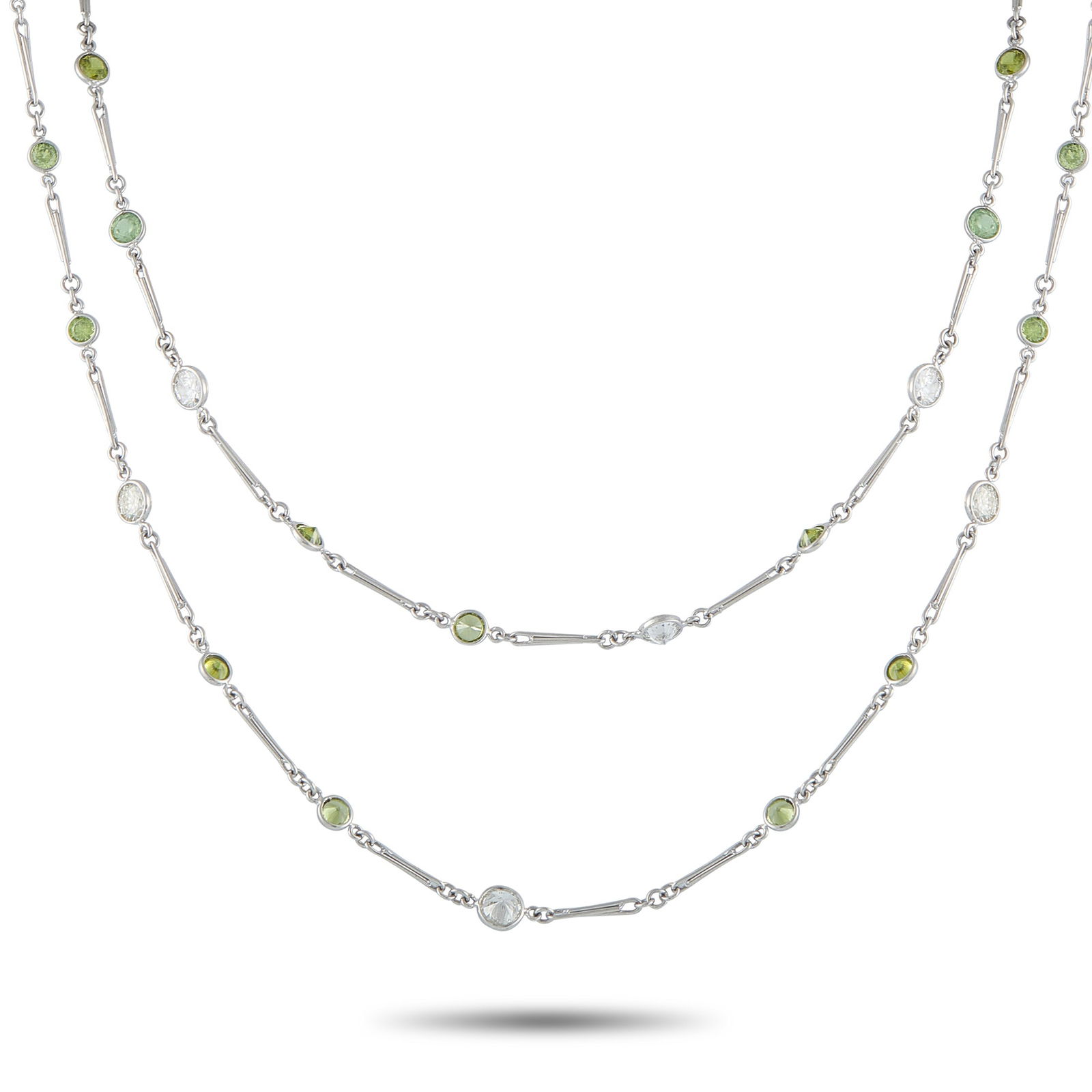 Exclusive Platinum 7.13ct Diamond and Demantoid Necklace: Add charm and sophistication to any ensemble with this elegant necklace. Glittering green Demantoid with a total weight of 22.92 carats contrasts beautifully against this piece’s sleek Platinum sett