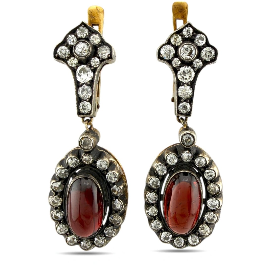 Earrings - 14 kt. Yellow gold, Antique Imperial Russian 56K Yellow Gold 2.46ct and Burgundy Garnet: Antique Imperial Russian 56K Yellow Gold 2.46ct and Burgundy Garnet EarringsAn exquisite pair of antique Imperial Russian earrings crafted in 56K gold (equivalent to 14 karats), adorned with old-cut d