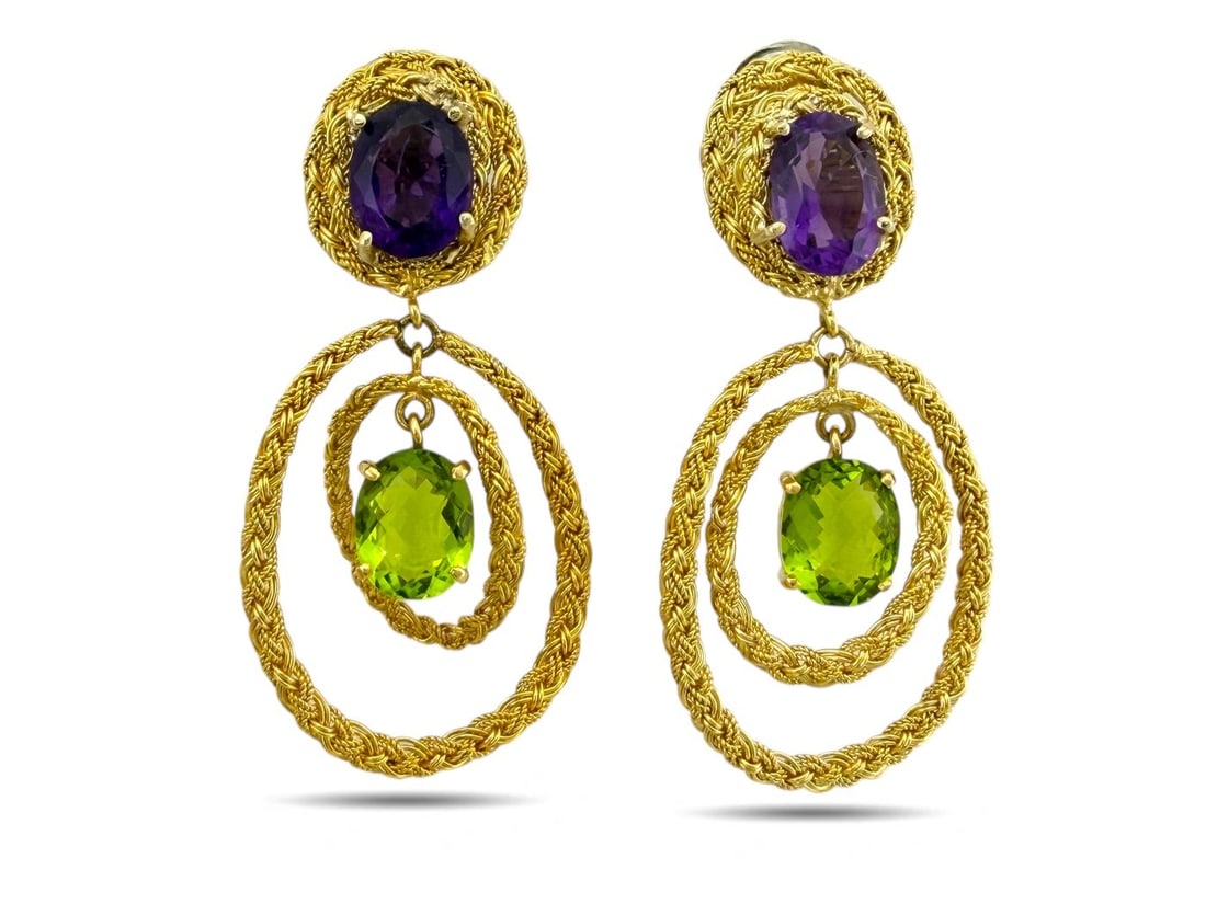 18 kt. Yellow gold, Exclusive 18K Yellow Gold Amethyst and Peridot Clip-On Earrings: Exclusive Italian 18K Yellow Gold Amethyst and Peridot Clip-On EarringsElegant and vibrant, these 18K yellow gold clip-on earrings feature a striking combination of oval-cut amethysts and peridots. Ea