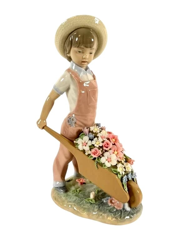 Lladro Limited Edition Porcelain Wheelbarrow with Flowers 1283 Rare: Lladró porcelain figurine #1283 titled 'Wheelbarrow with Flowers,' depicting a young figure in pink overalls pushing a wheelbarrow filled with colorful flowers. Crafted from fine glazed porcelain and