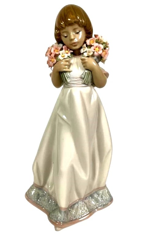LLADRO SPRING BOUQUETS 1987-87 SOCIETY PIECE 1987 PORCELAIN FIGURINE 7603: LLADRO SPRING BOUQUETS 1987-87 SOCIETY PIECE 1987 PORCELAIN FIGURINE 7603Lladro porcelain figurine titled 'Spring Bouquets,' model #7603, depicting a young girl holding flower bouquets. Stands 7.75 in