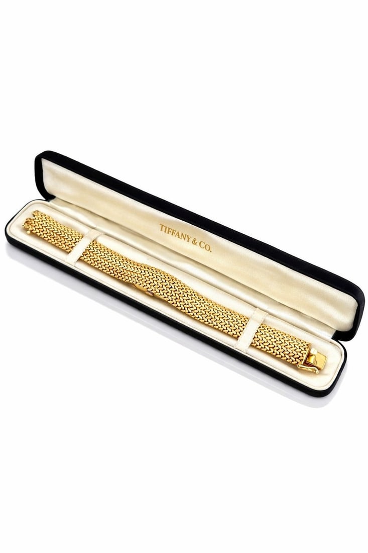 Tiffany & Co. 14K Gold Woven Bracelet Watch 45 Grams: Vintage Tiffany & Co. 14K Gold Woven Bracelet Watch – 45 GramsAn elegant vintage creation by Tiffany & Co., this exceptional 14K yellow gold woven bracelet watch showcases a beautifully crafted