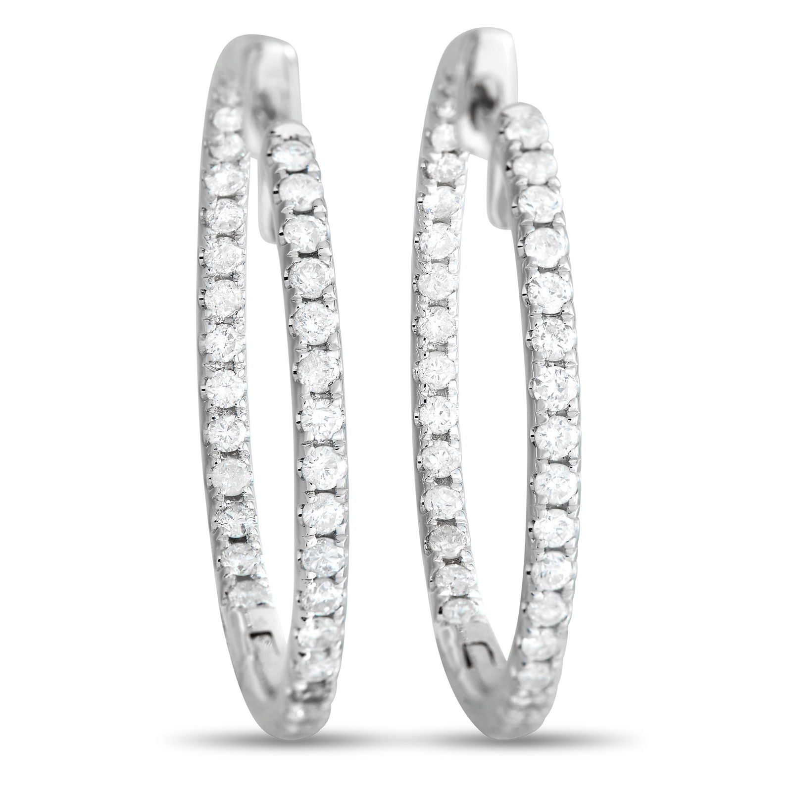 14K White Gold 1.0ct Diamond Inside-Out Hoop Earrings: A must-have in every lady’s jewelry box. This is your modern diamond hoop designed with an in-and-out display of sparkle. Each hoop features round diamonds running through its outer front face and i