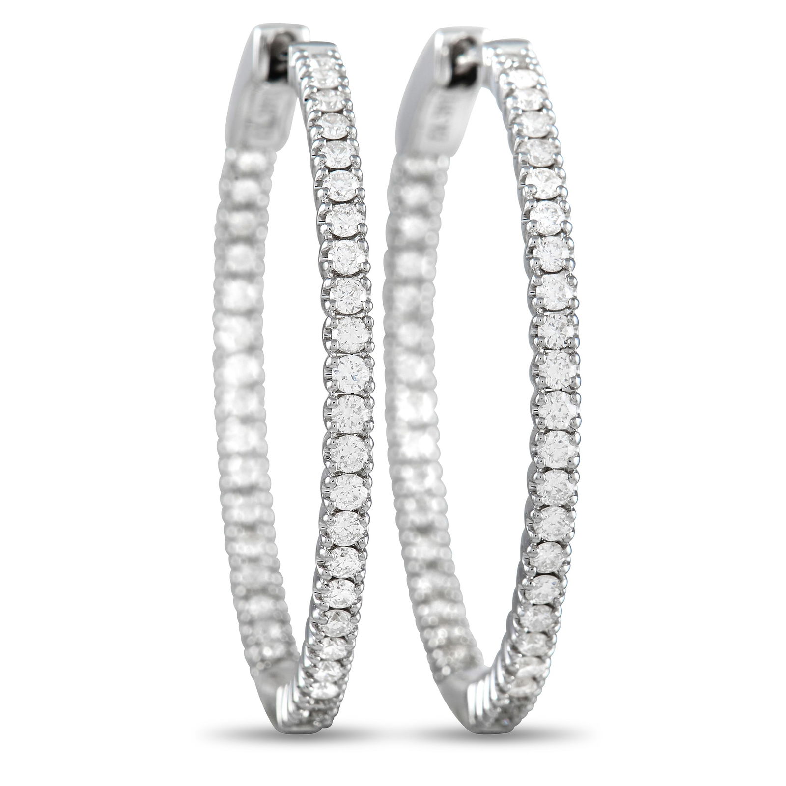 14K White Gold 0.98 ct Diamond Inside-Out Hoop Earrings: Sleek and stylish, these 14K White Gold hoop earrings will never go out of style. The minimalist design allows their 0.98 carats of sparkling inset diamonds to take center stage. Each one measures 1.1