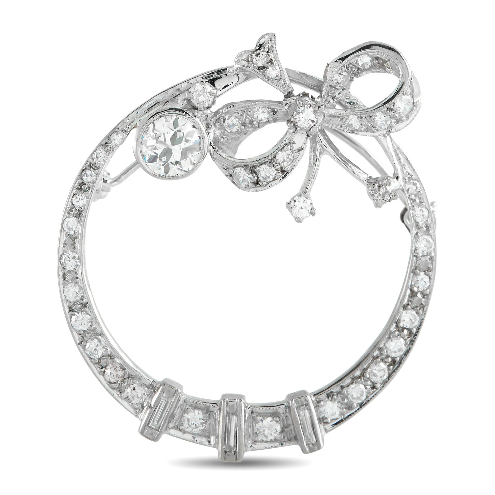 18K White Gold 1.50ct Diamond Brooch: Intricate metalwork and an openwork design make this brooch an instant classic. Crafted from 18K White Gold, the circular setting is elevated by a charming bow motif. Diamonds with a total weight of
