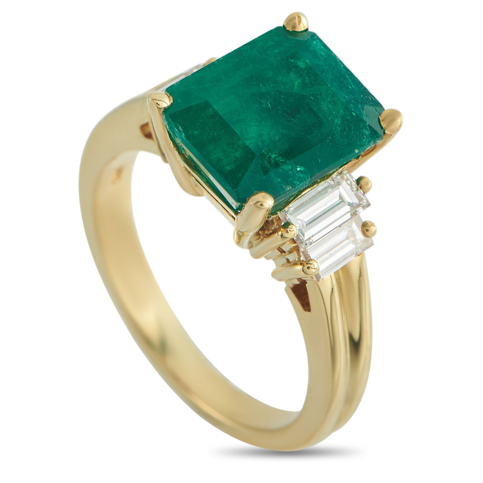 18K Yellow Gold 0.05ct Diamond and Emerald Ring: Here is an alternative engagement choice for those drawn toward a ring with a strong sense of individuality. In this piece, a 4.27-carat emerald sits in four yellow gold prongs. Duos of baguette