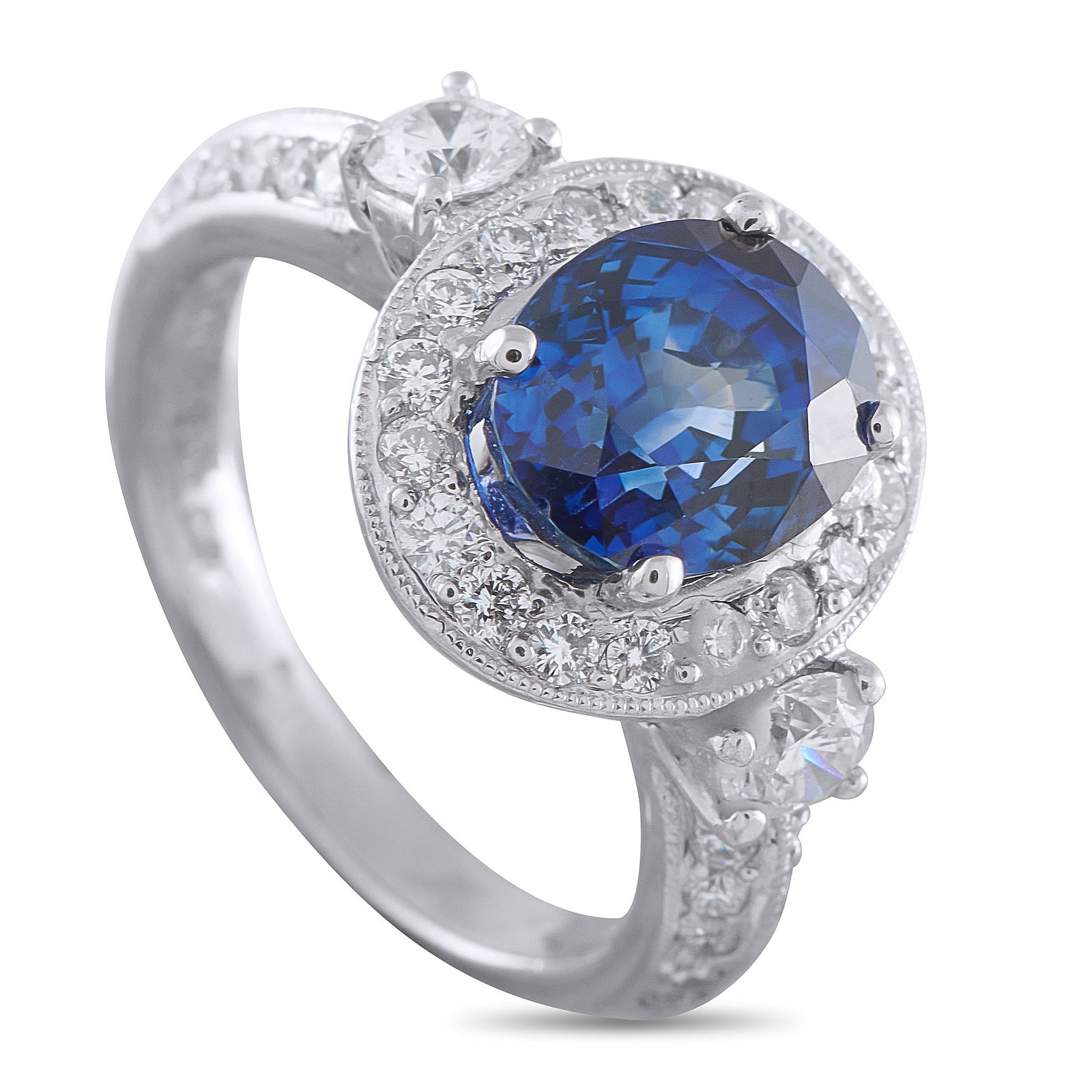 Platinum 0.78ct Diamond and Sapphire Ring: A stunning 3.92 carat Sapphire makes a statement at the center of this impeccably crafted luxury ring. Set in Platinum, Diamonds with a total weight of 0.78 carats surround the center stone and extend